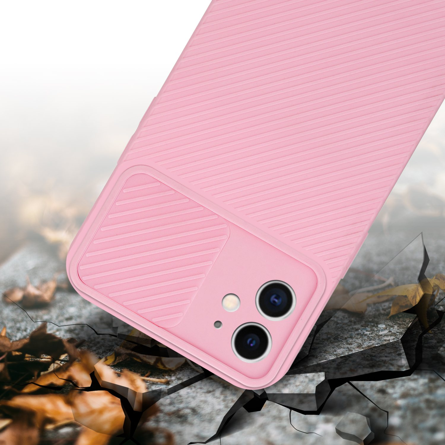 Custodia rosa per telefono con retro strutturato, su superficie di cemento crepata.