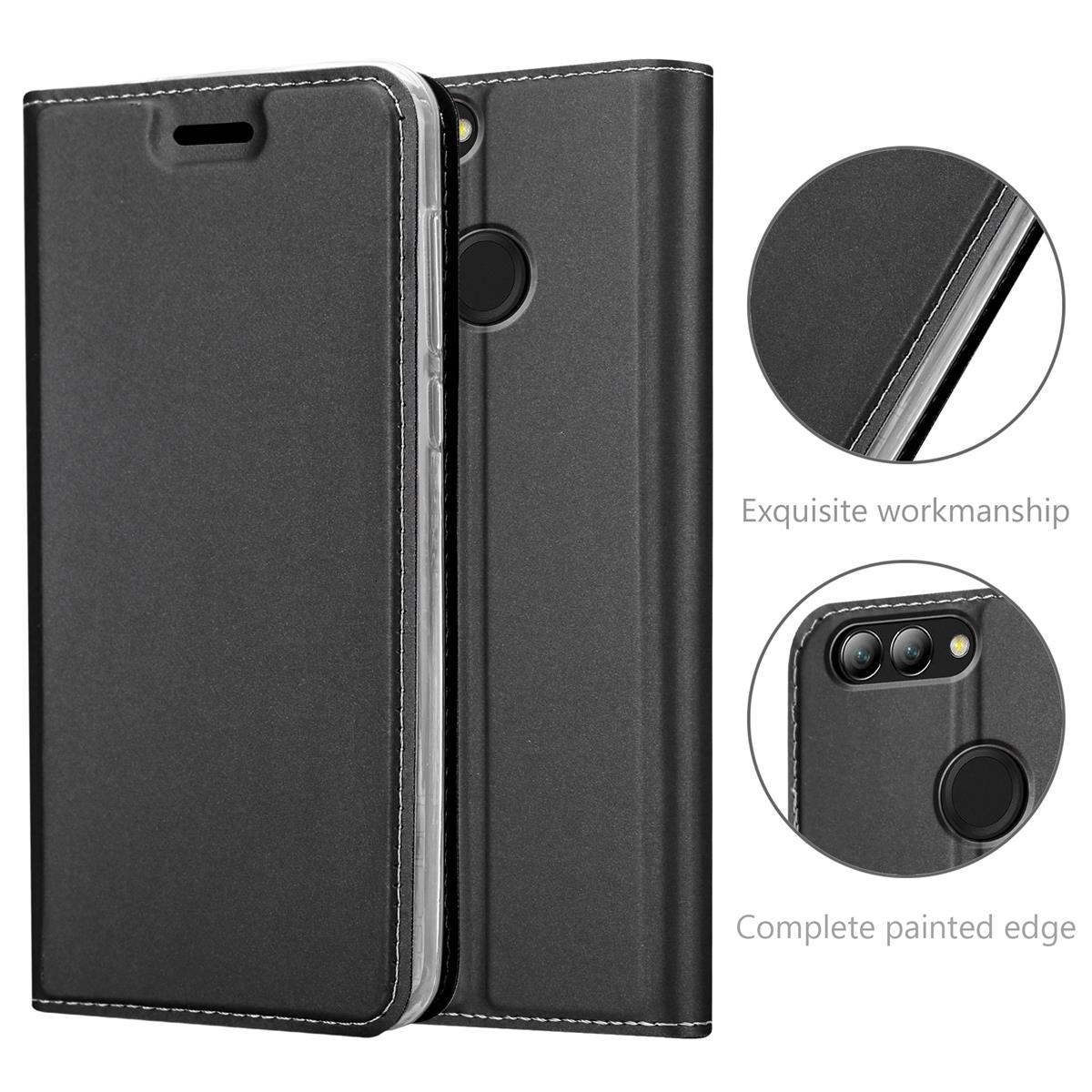 Coque de téléphone noire avec surpiqûres blanches, deux détails rapprochés : bord et zone de la caméra.