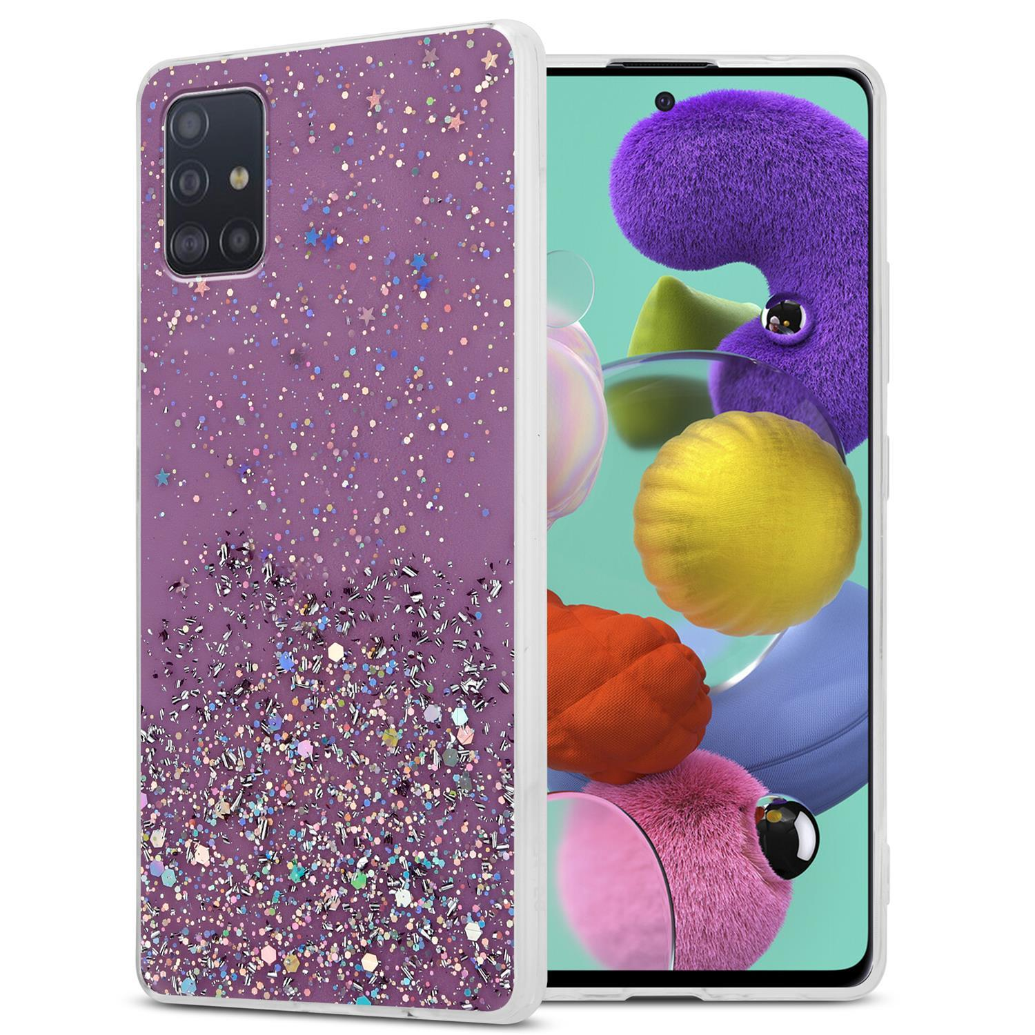 Ein Telefon mit einer lila Glitzerhülle. Die Hülle hat Sterne und Glitzer, das Telefon ein Cartoon-Bild.