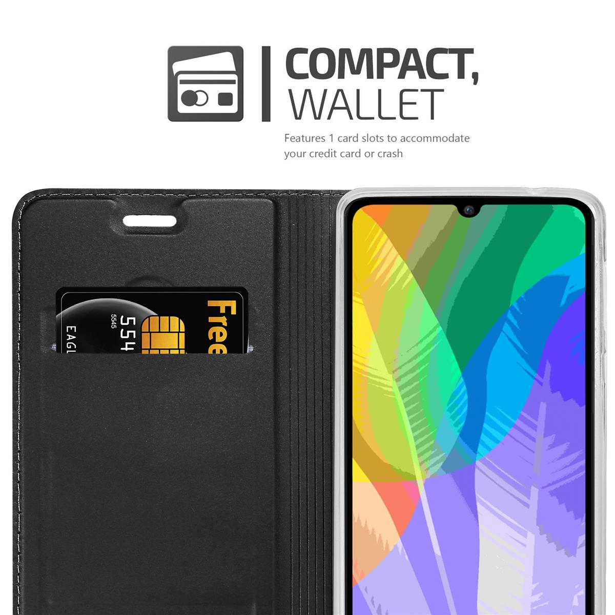 Eine schwarze Handyhülle mit Kartenfach, das eine Kreditkarte hält, neben einem Smartphone, auf weißem Hintergrund.