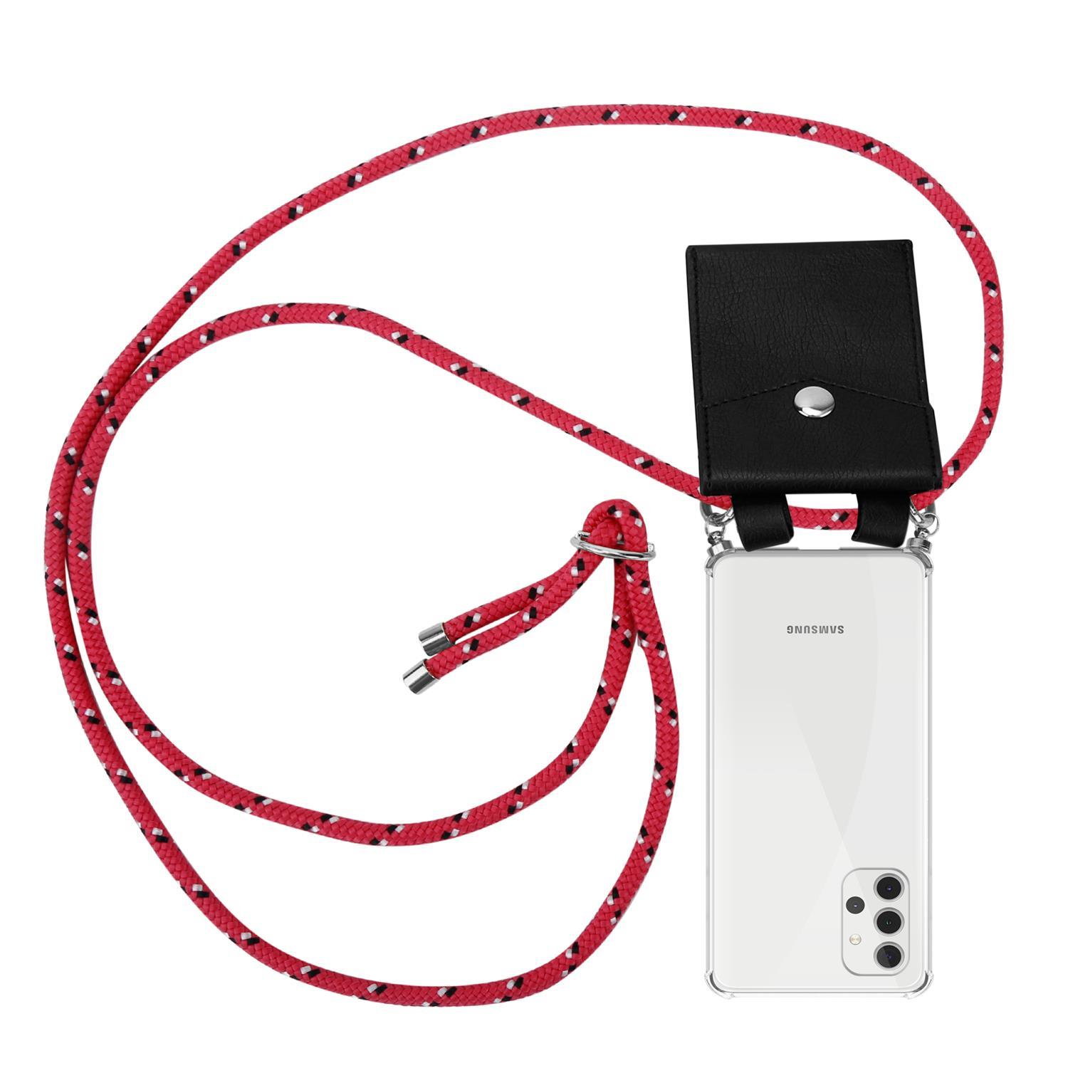 Ein Telefon mit roter und schwarzer Seilschlaufe und einer schwarzen brieftaschenähnlichen Hülle.