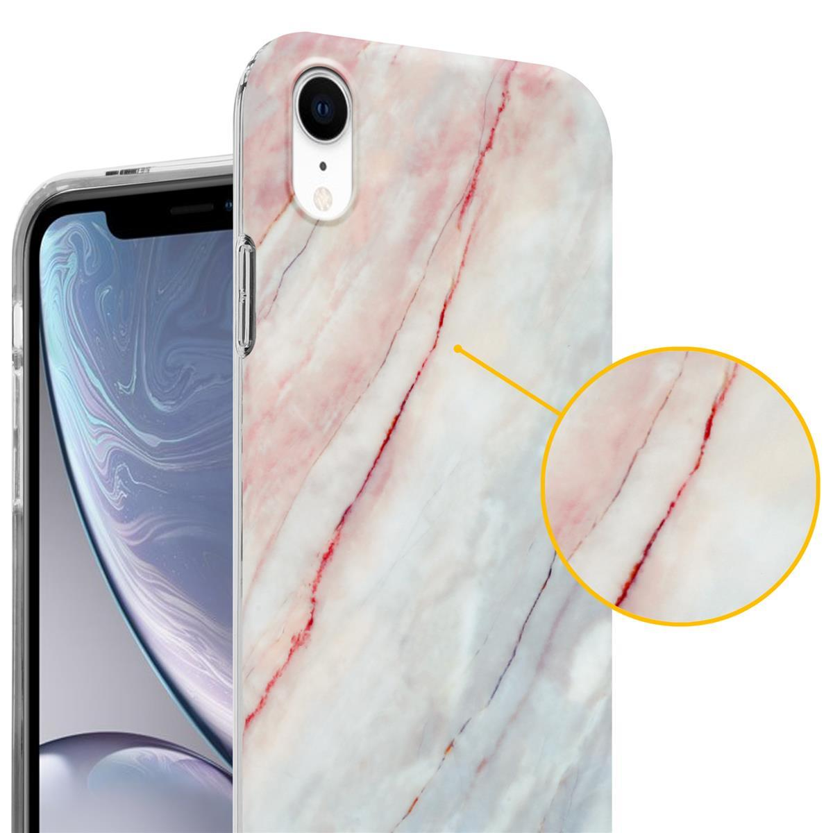Custodia per telefono con design a marmo bianco. Un telefono è visibile sullo sfondo. Primo piano.