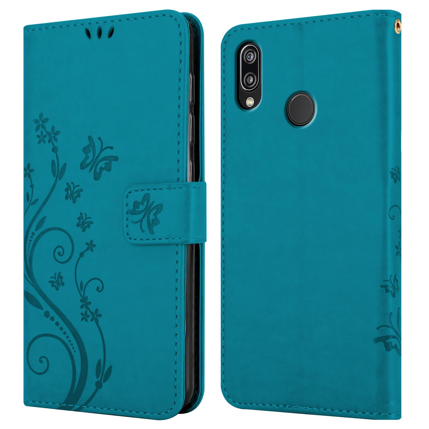 Türkisfarbene Handyhülle, geschlossen, mit Blumendesign. Geöffnet mit Telefon. Schmetterlinge sind Teil des Designs.