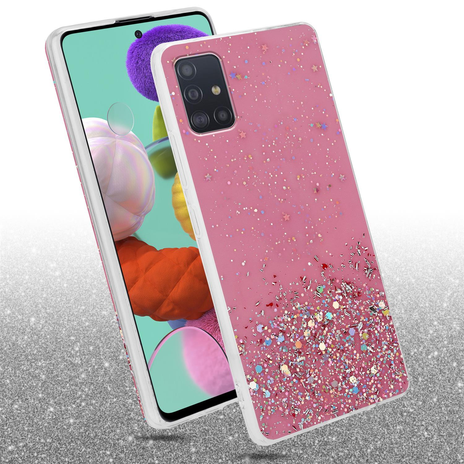 Rosa Handyhülle mit einem Telefon darin. Glitzernd, mit einer rissigen Oberfläche.