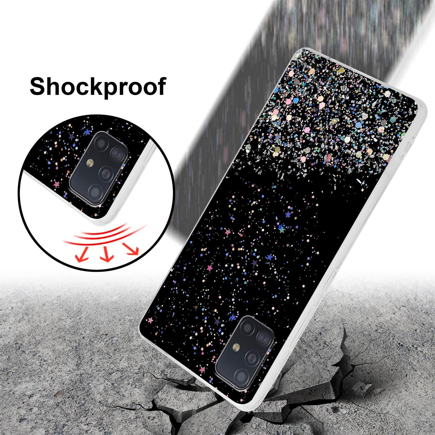 Schwarze Handyhülle mit Glitzerdesign auf zerbrochenem Betonboden.