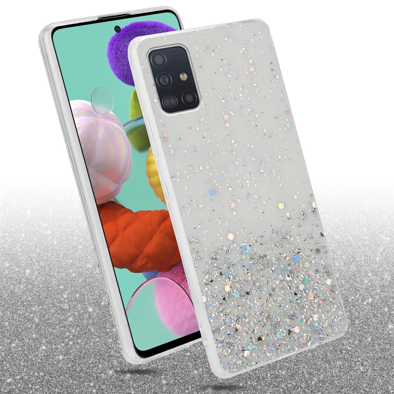Weiße Handyhülle mit Glitzer. Daneben ein Handy. Glitzernder Hintergrund.