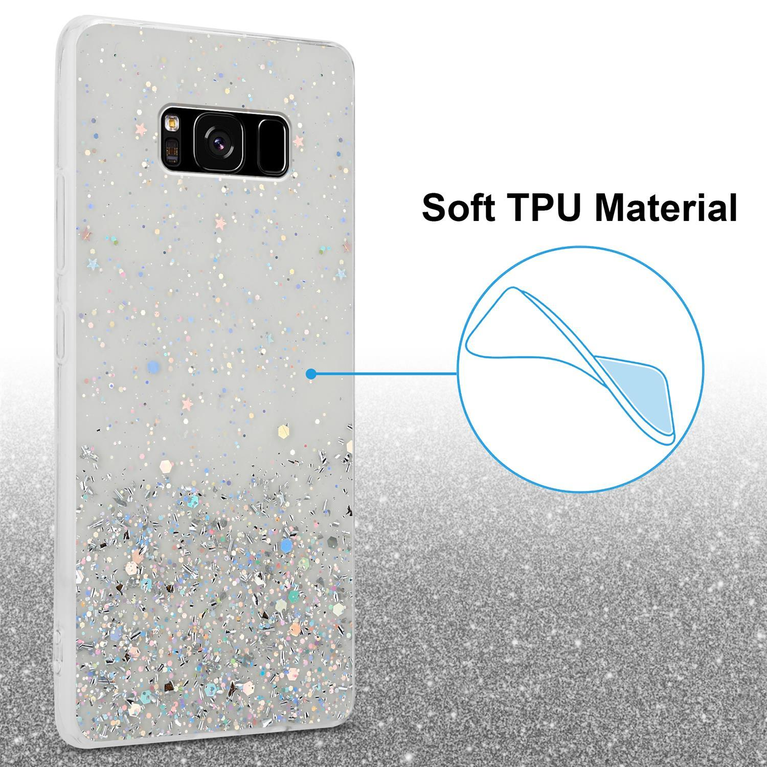 Handyhülle mit Glitzer. Ein Telefon ist darin. Die Hülle ist weiß mit Glitzer. Text: Weiches TPU-Material.