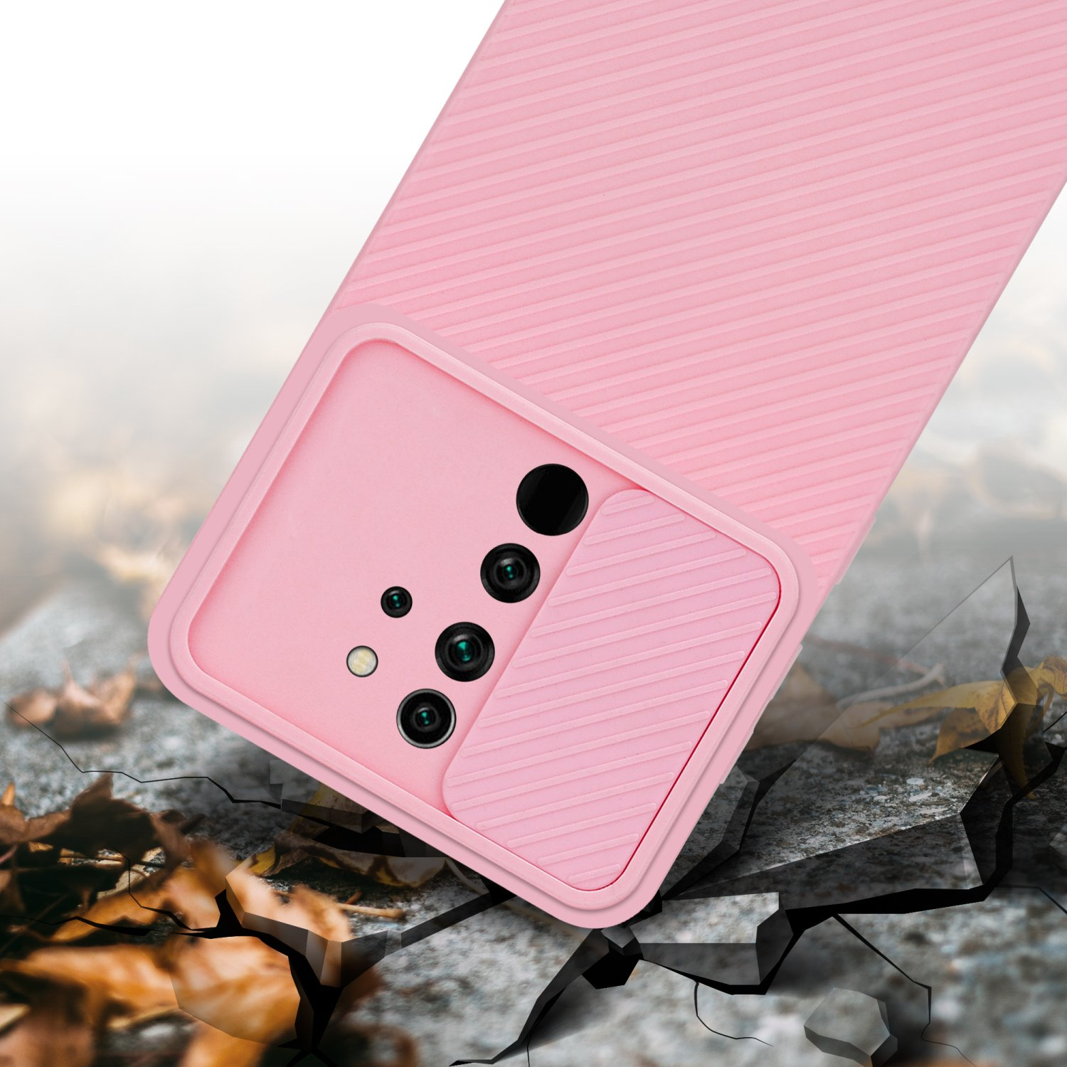 Una custodia per telefono rosa. La custodia ha un design strutturato. La custodia del telefono è su un terreno incrinato.