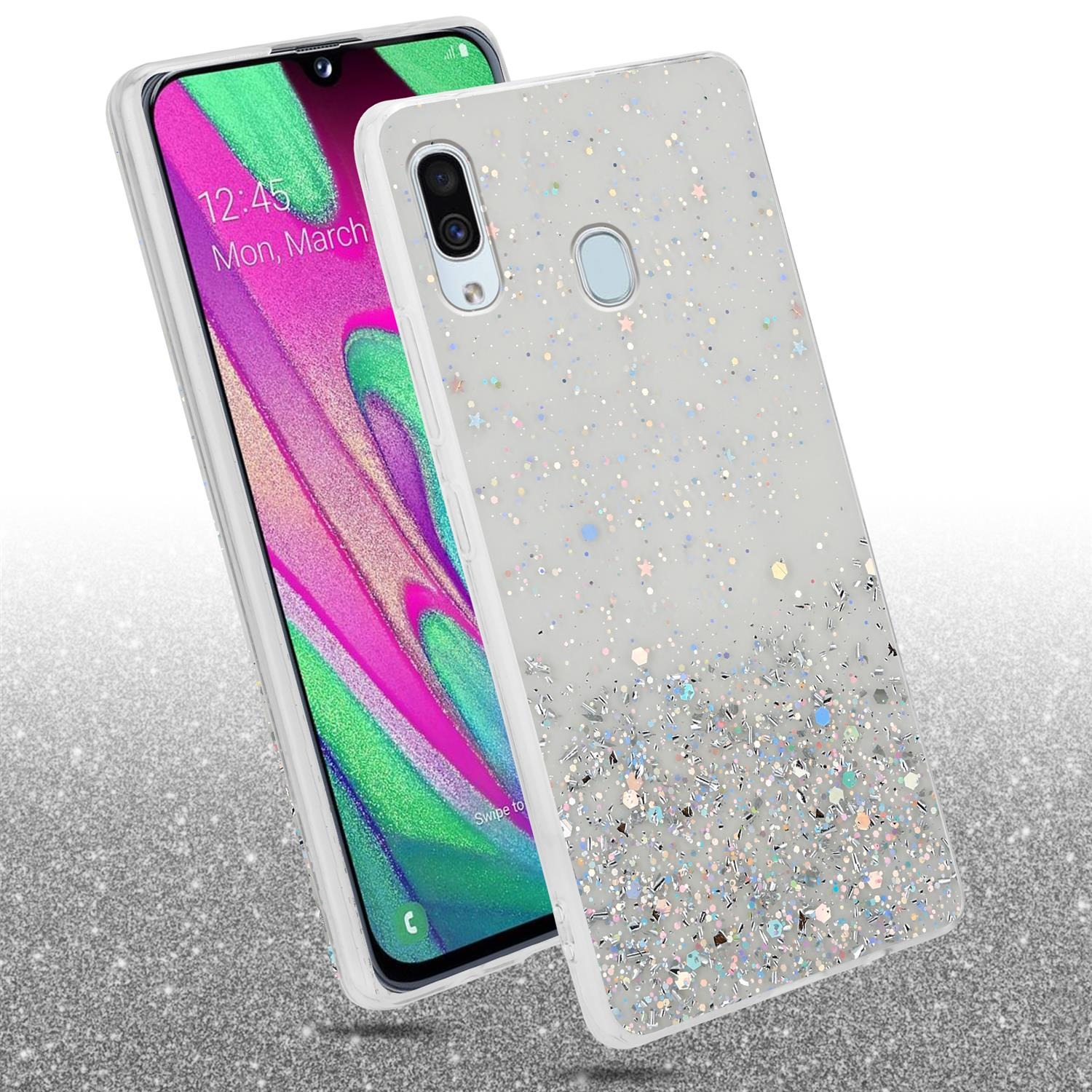 Handyhüllen mit Glitzer. Eine Hülle ist auf einem Telefon, die andere daneben.