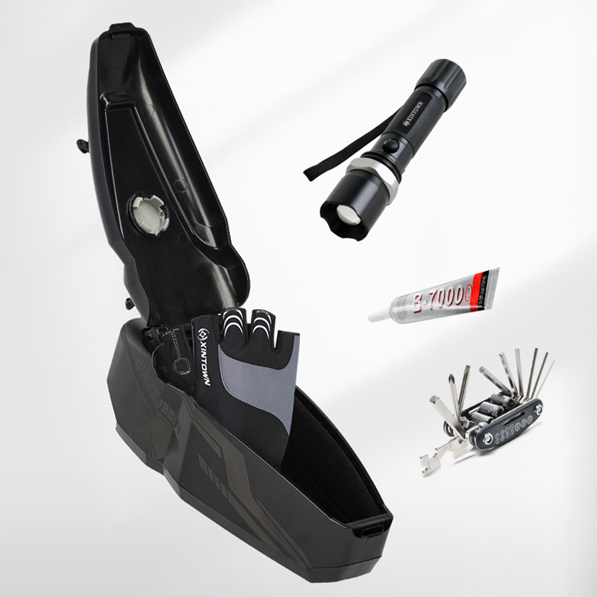 Geöffnete schwarze Tasche mit Werkzeugen. Enthält Handschuhe, Taschenlampe und eine Tube Kleber.
