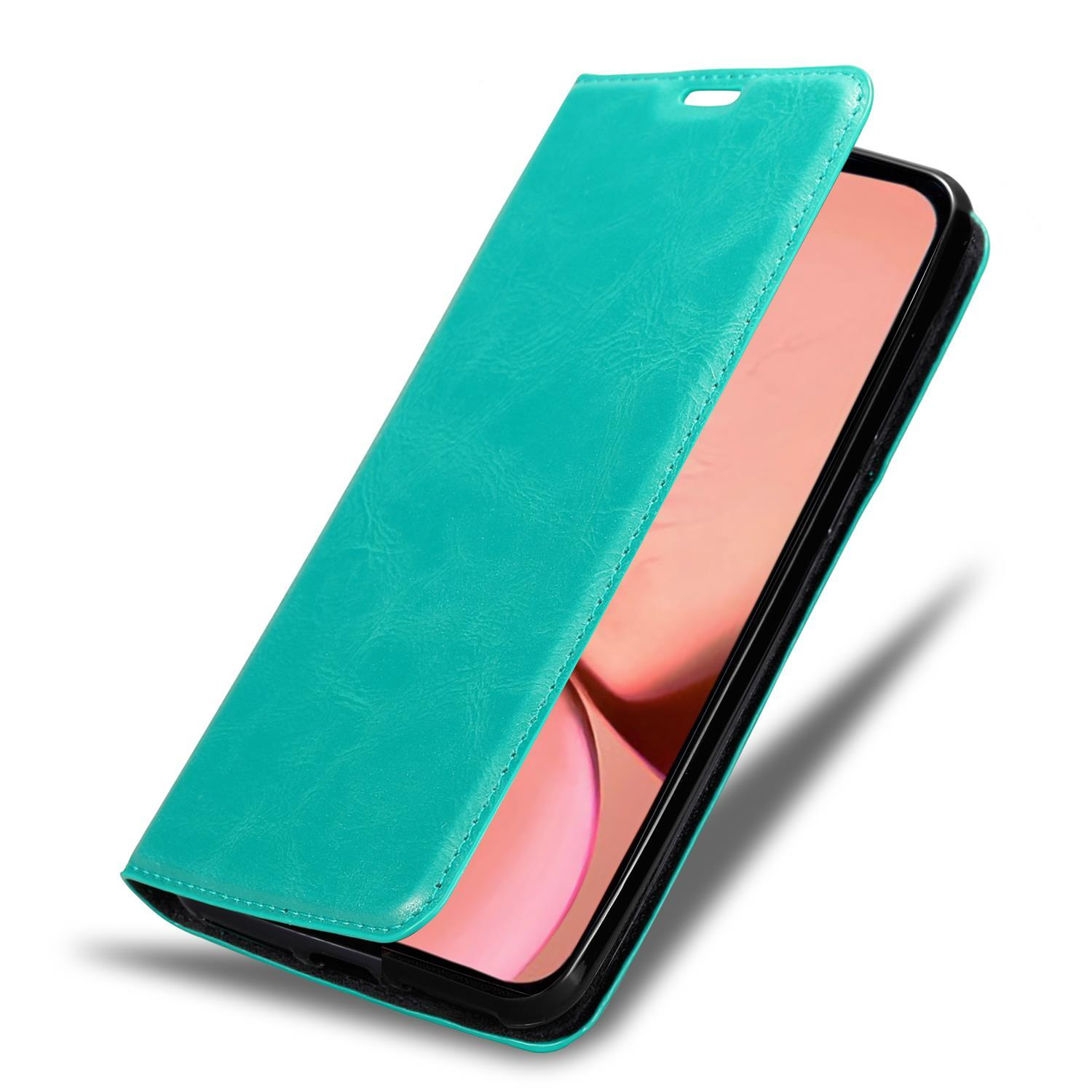 Eine türkisgrüne Leder-Handyhülle, geöffnet, zeigt einen rosa Handy-Bildschirm.