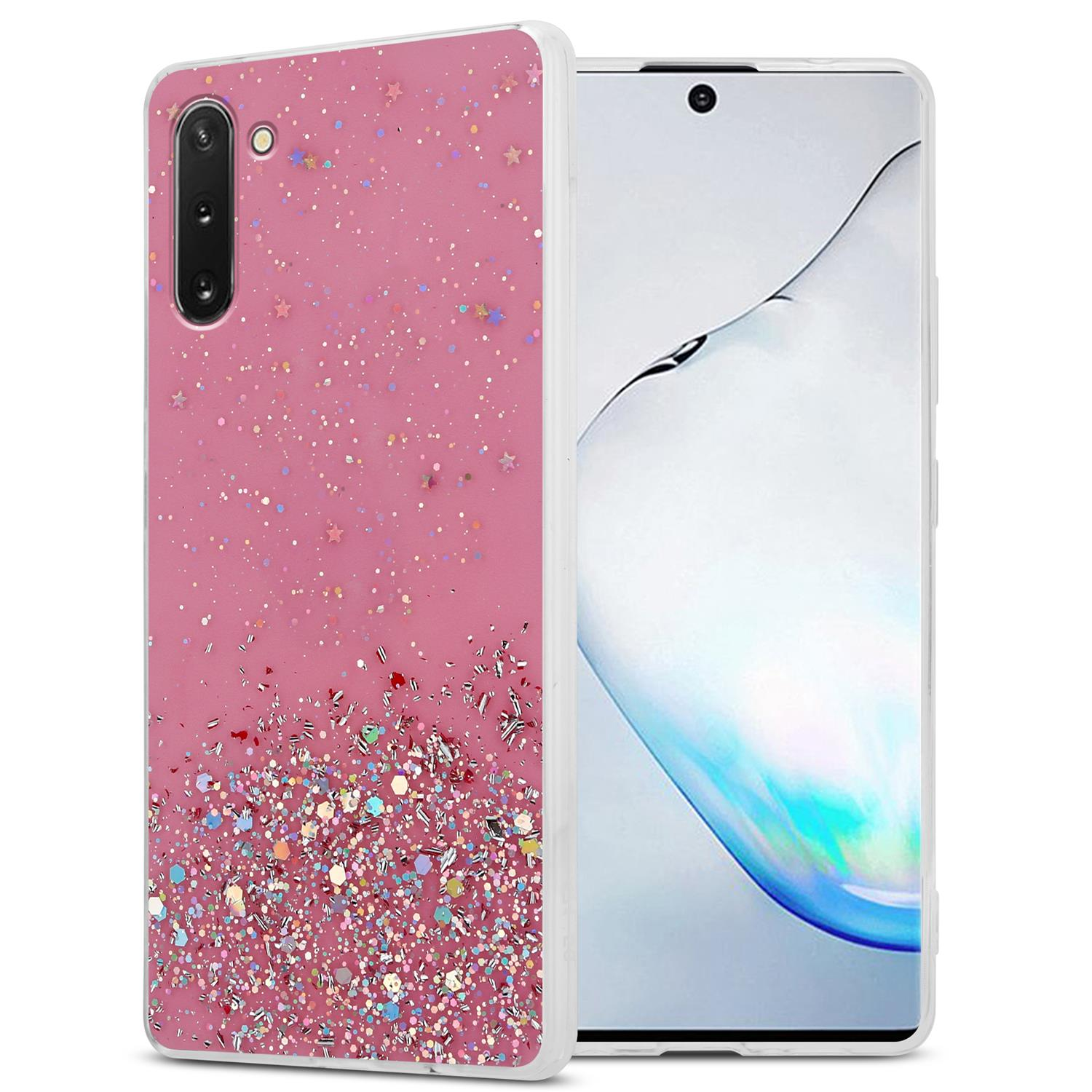 Custodia rosa per telefono con glitter e un telefono.