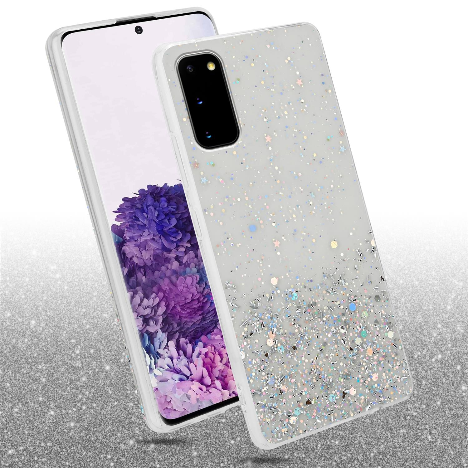 Handyhülle mit Glitzer. Dahinter ein Telefon. Silberner Glitzer auf Weiß, mit Sternen.