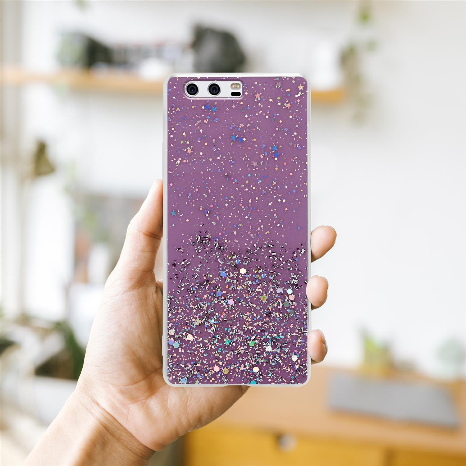 Eine Hand, die ein Telefon mit einer lila Hülle hält. Die Hülle hat ein Glitzerdesign.