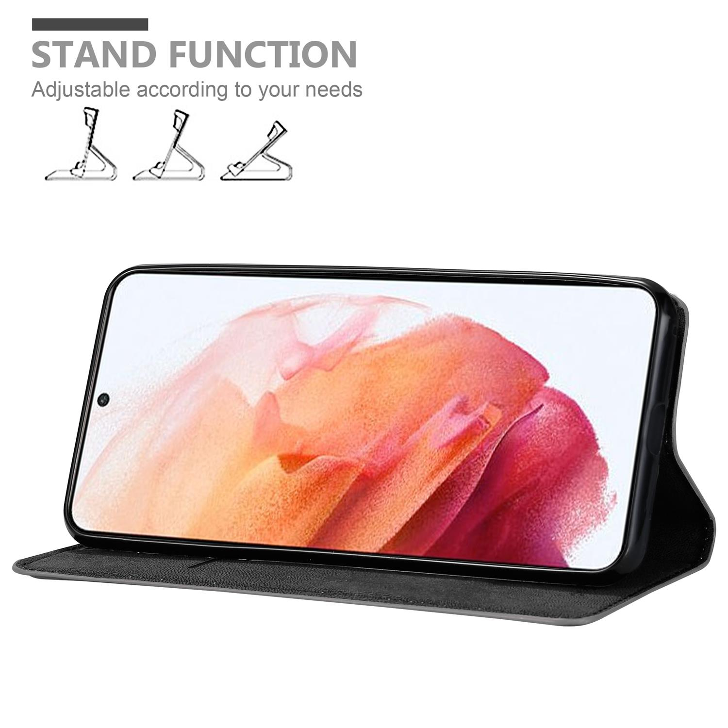 Coque de téléphone noire avec téléphone à l'intérieur. Fonction support montrée dans des schémas, avec différentes positions de support.