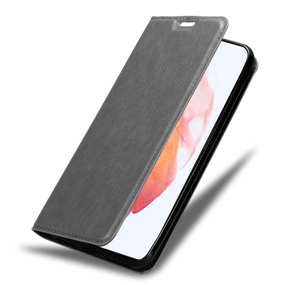 Eine graue Handyhülle, das Telefon ist geöffnet und der Bildschirm ist sichtbar. Die Hülle hat einen Magnetverschluss.