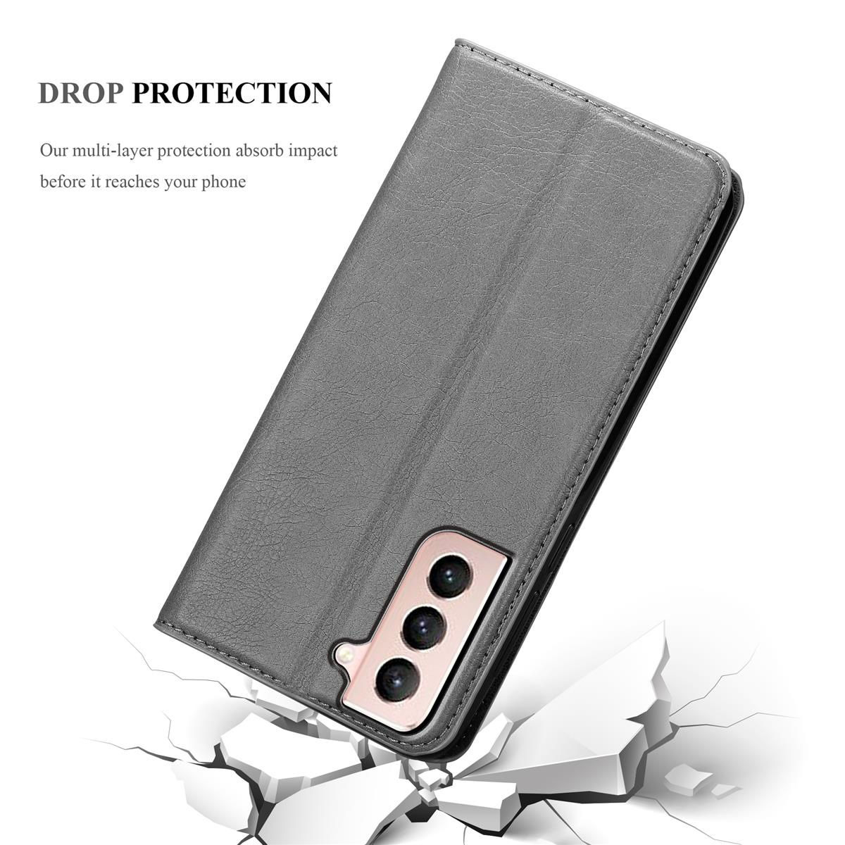 Un étui de téléphone gris avec un couvercle en position ouverte. Une surface endommagée en dessous avec un texte sur la protection contre les chutes.
