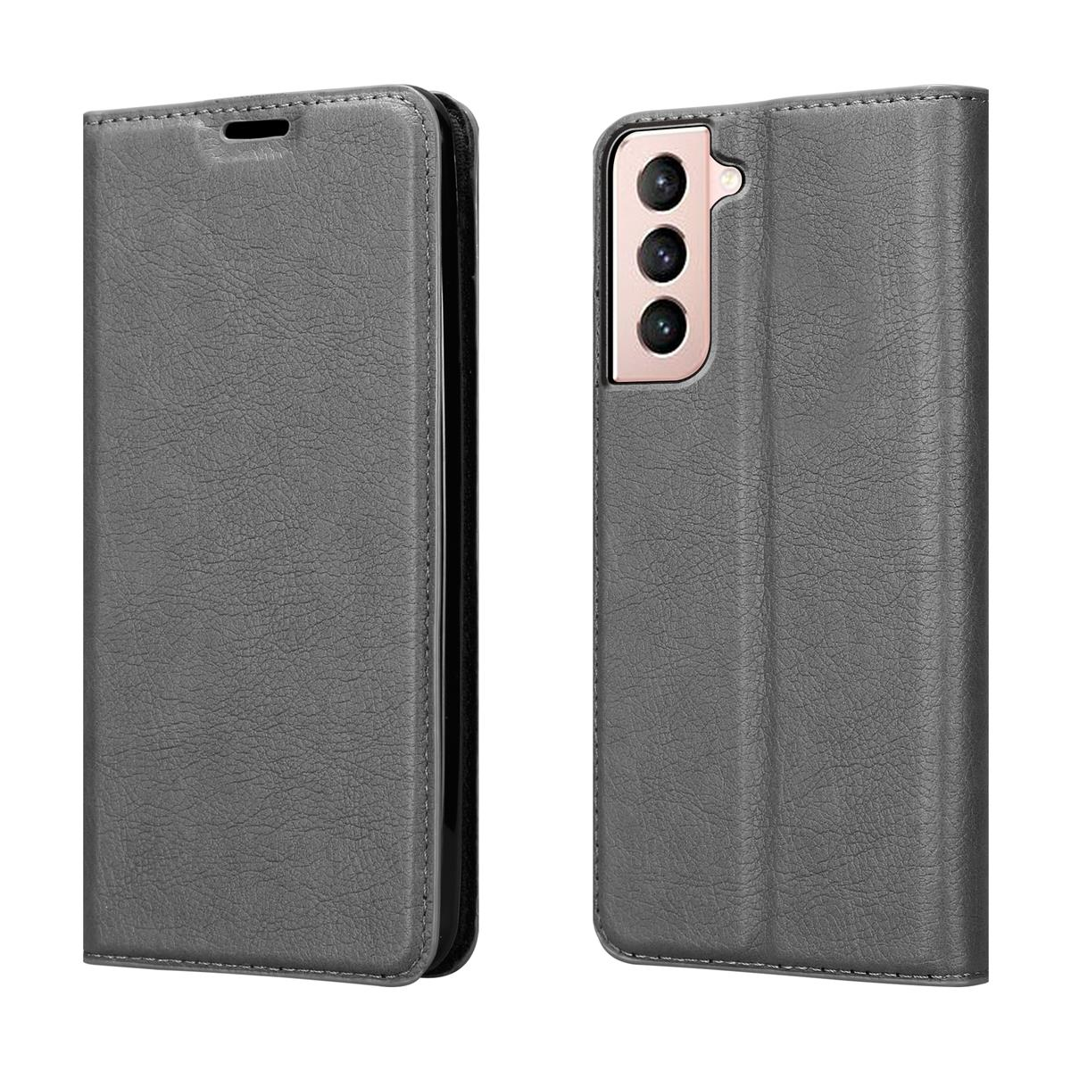 Deux étuis de téléphone en cuir gris. Un fermé, un ouvert, montrant la zone de la caméra du téléphone.