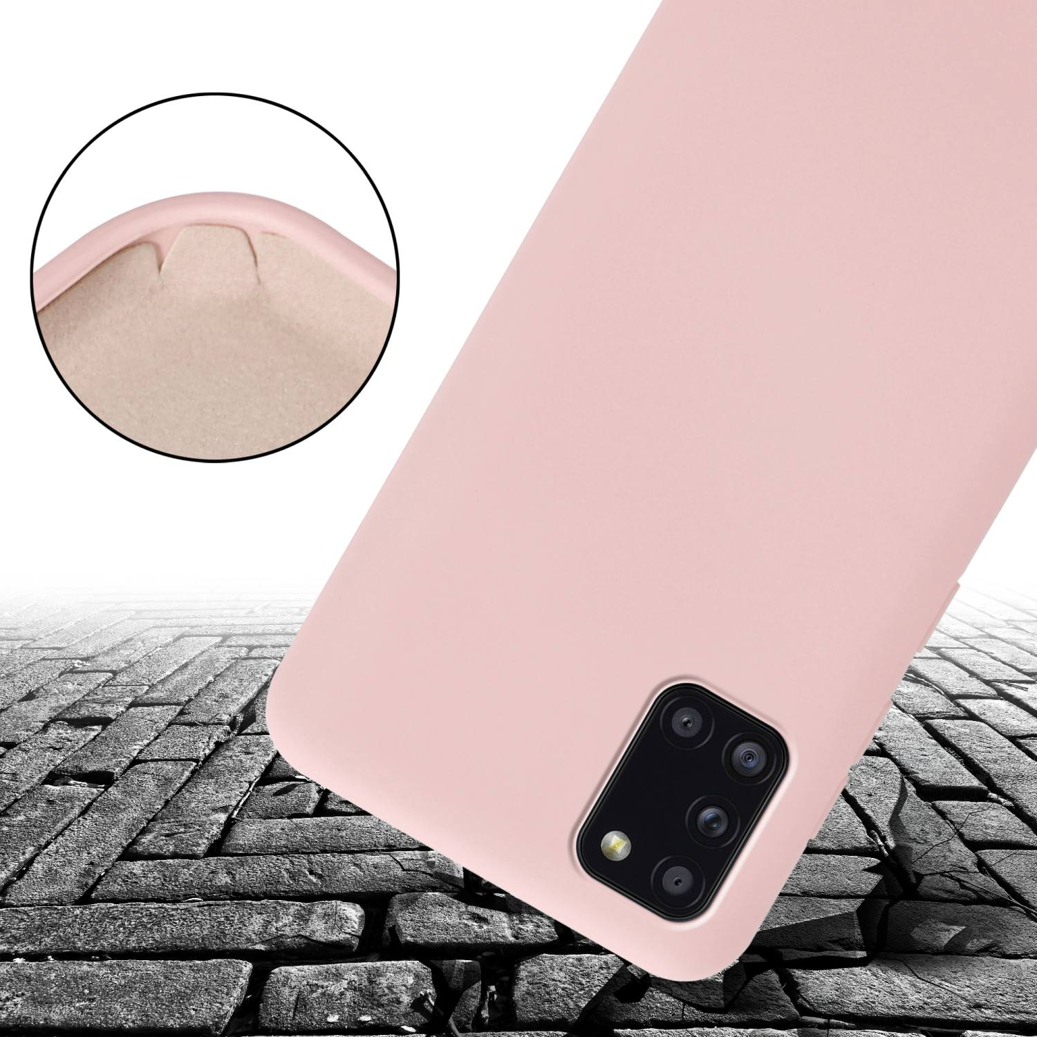 Una custodia rosa per telefono è su una superficie screpolata, simile a pietra. Un primo piano mostra la consistenza morbida.