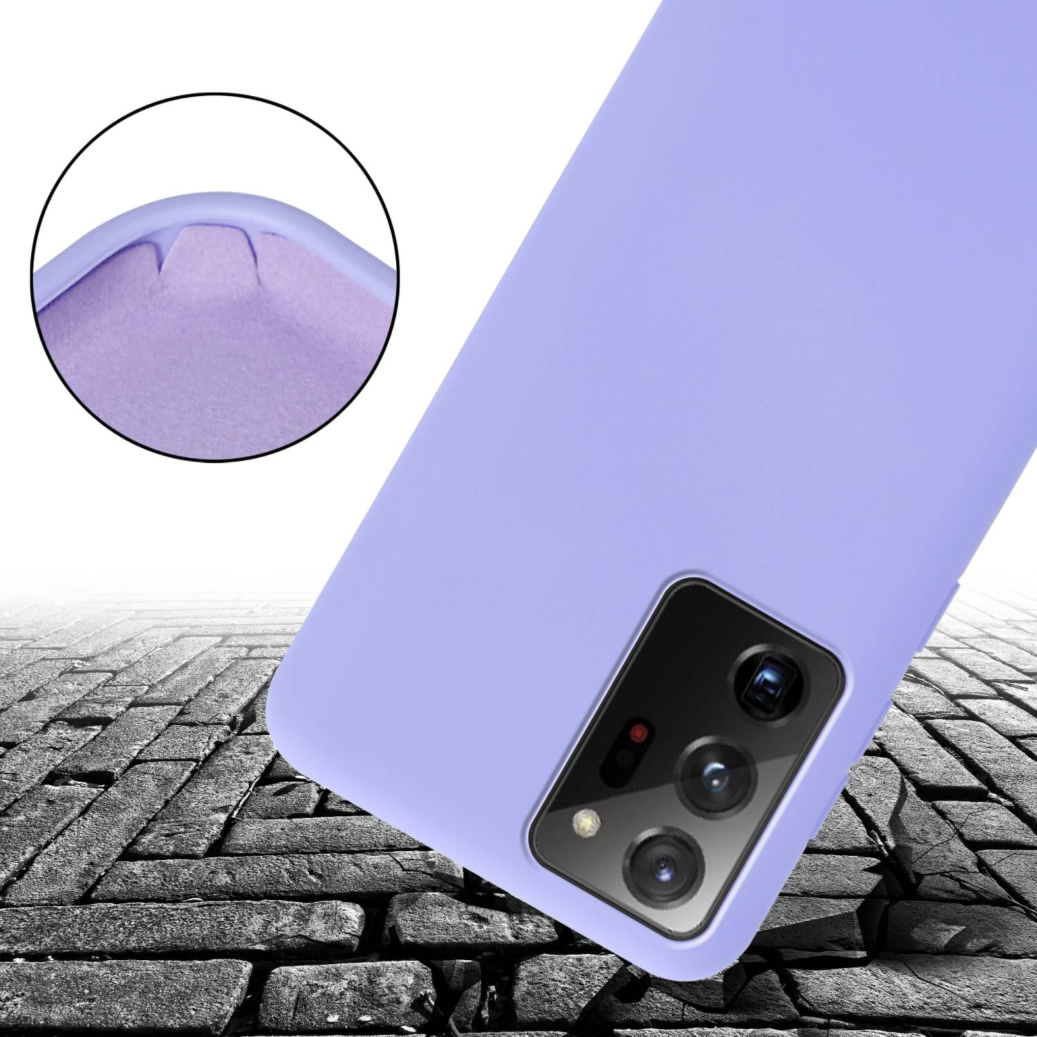 Una custodia per telefono viola. Primo piano sull'angolo della custodia e del telefono. Lo sfondo mostra una strada di mattoni.