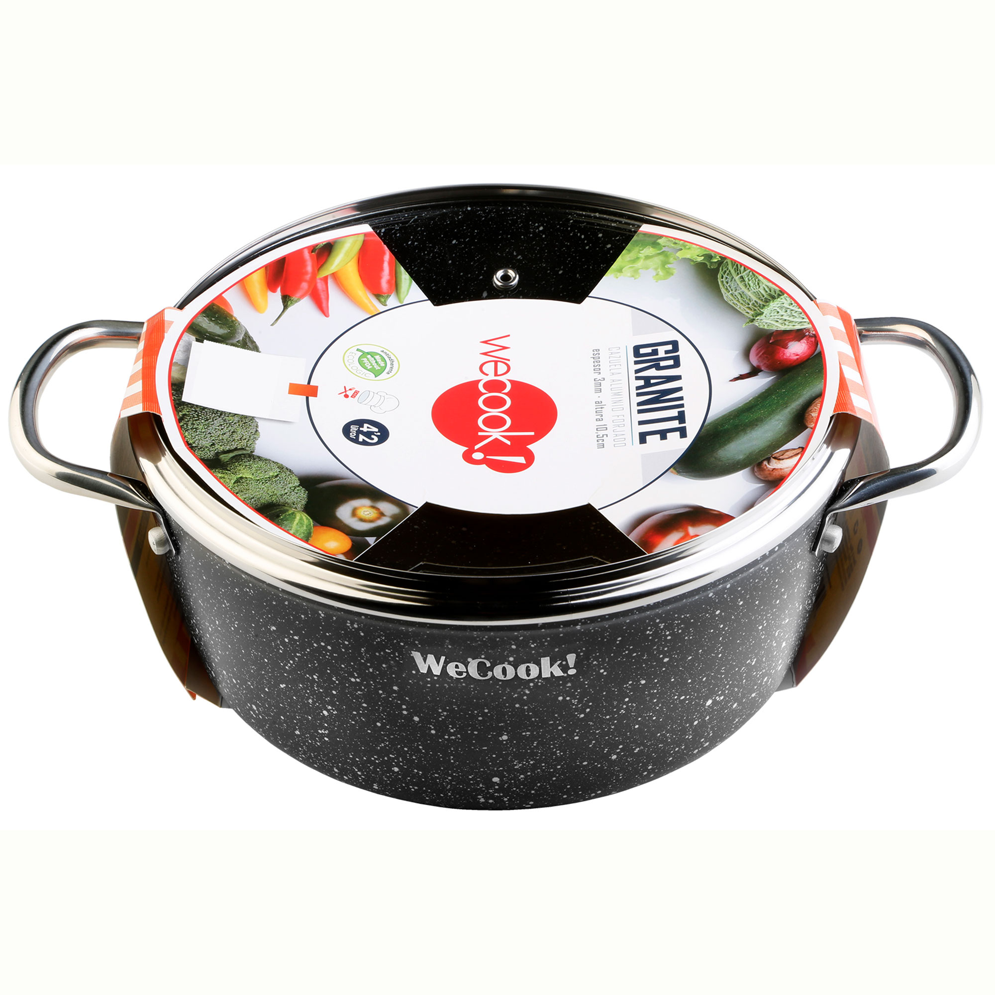 Olla de granito negro con tapa de cristal. Verduras en la tapa.