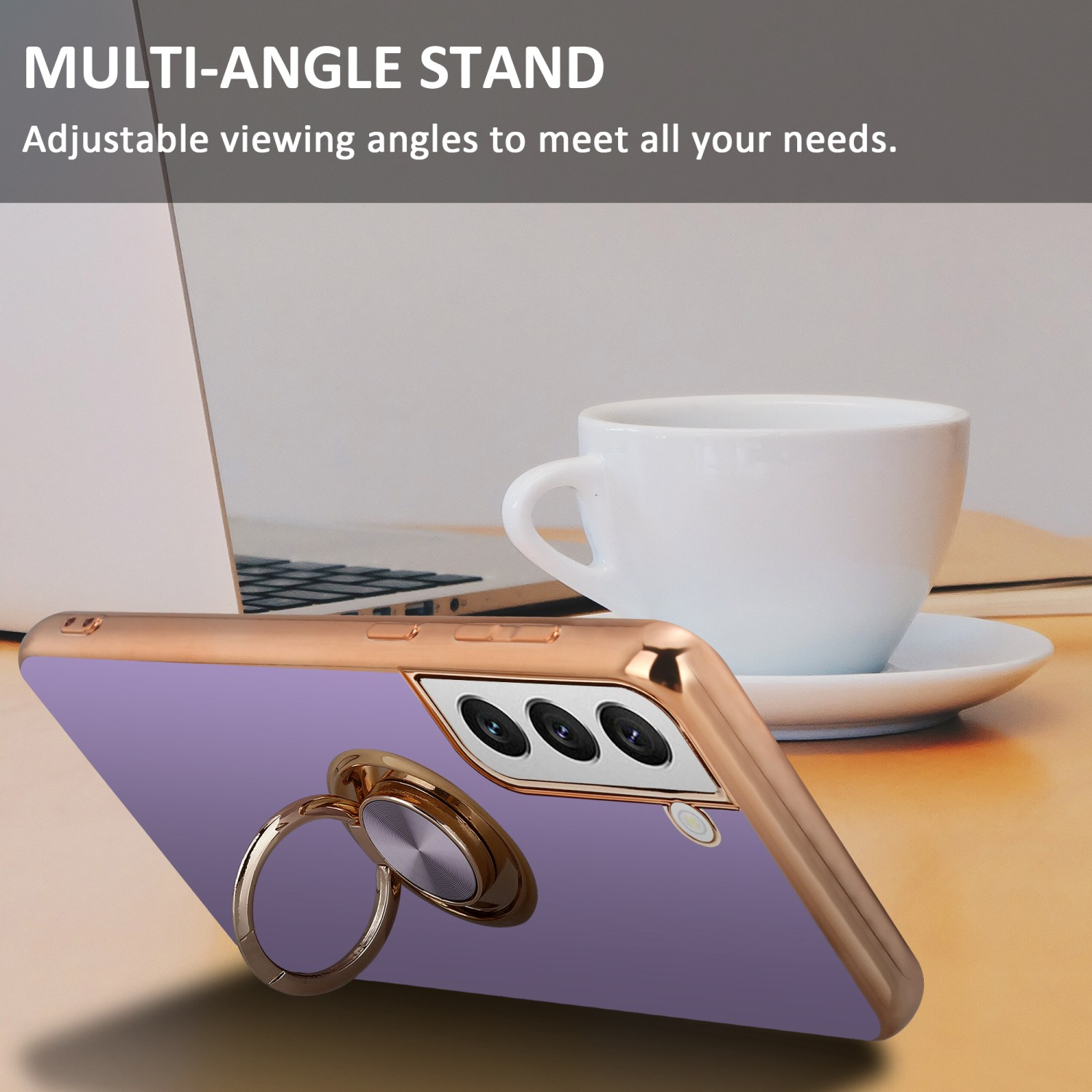 Custodia per telefono su un tavolo. Porta anello. Tazza di caffè e un laptop sullo sfondo.
