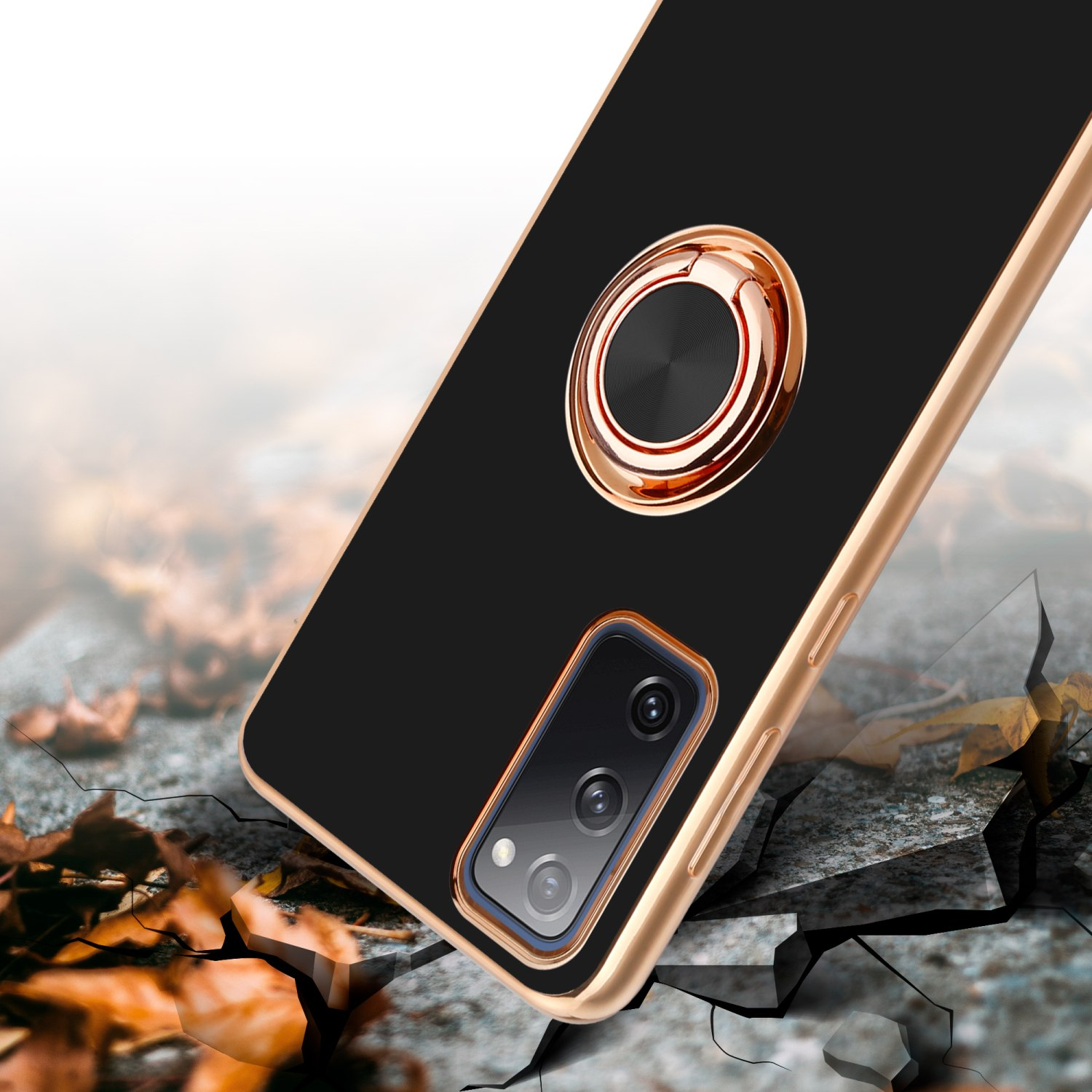 Eine schwarze Handyhülle mit einem goldenen Ringhalter. Der Hintergrund hat einen Riss-Effekt.