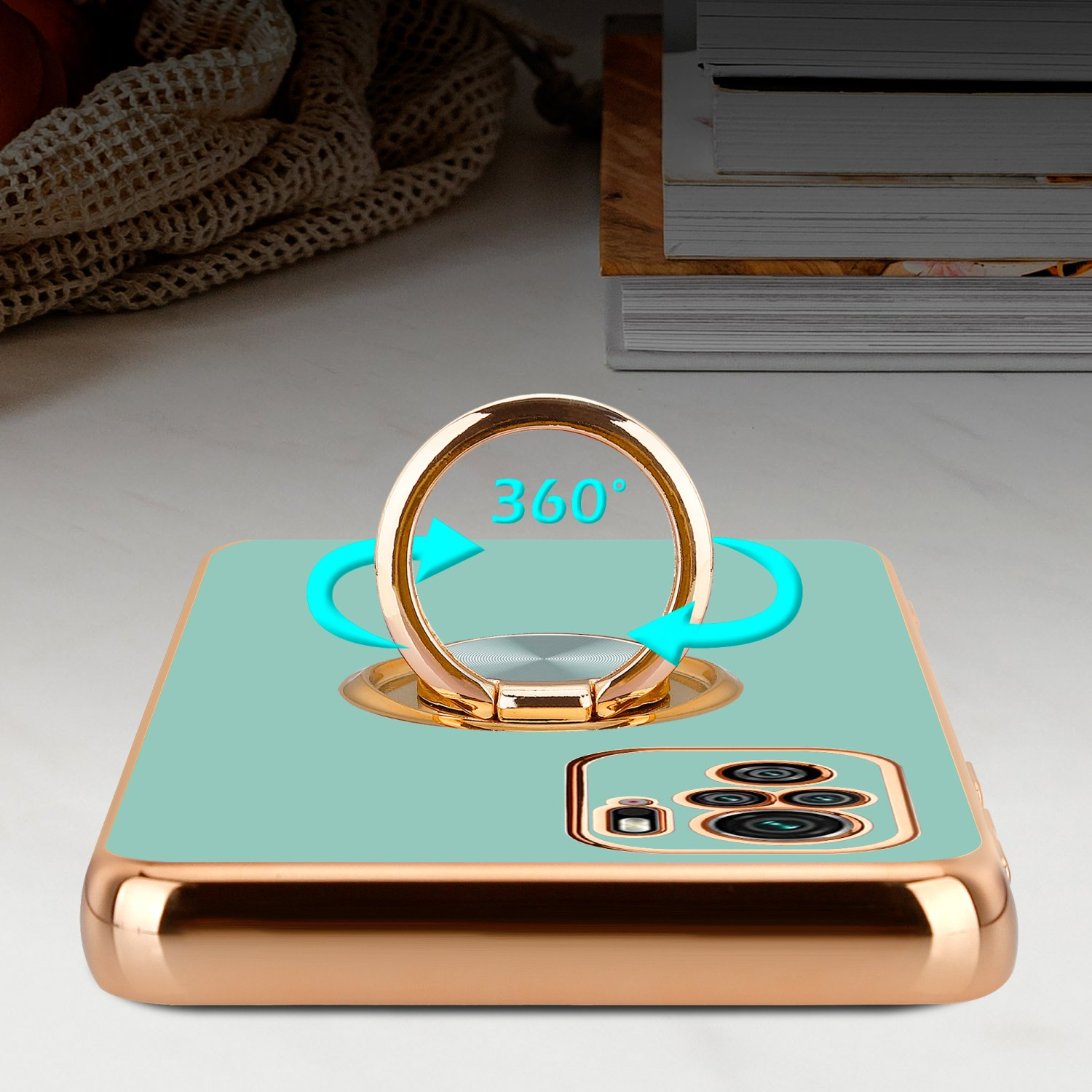 Custodia per telefono con anello di supporto, colore oro con retro azzurro.