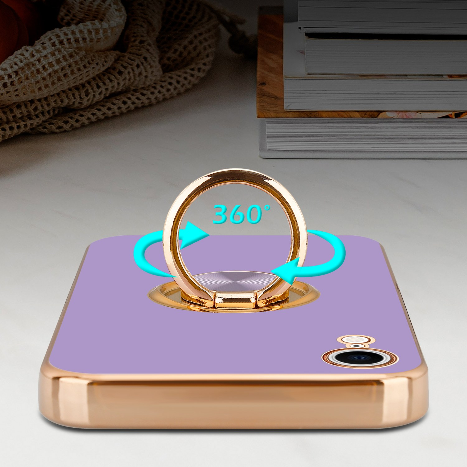 Lila Telefon mit Ringhalter. Blaue Pfeile zeigen 360° Drehung. Goldrand.