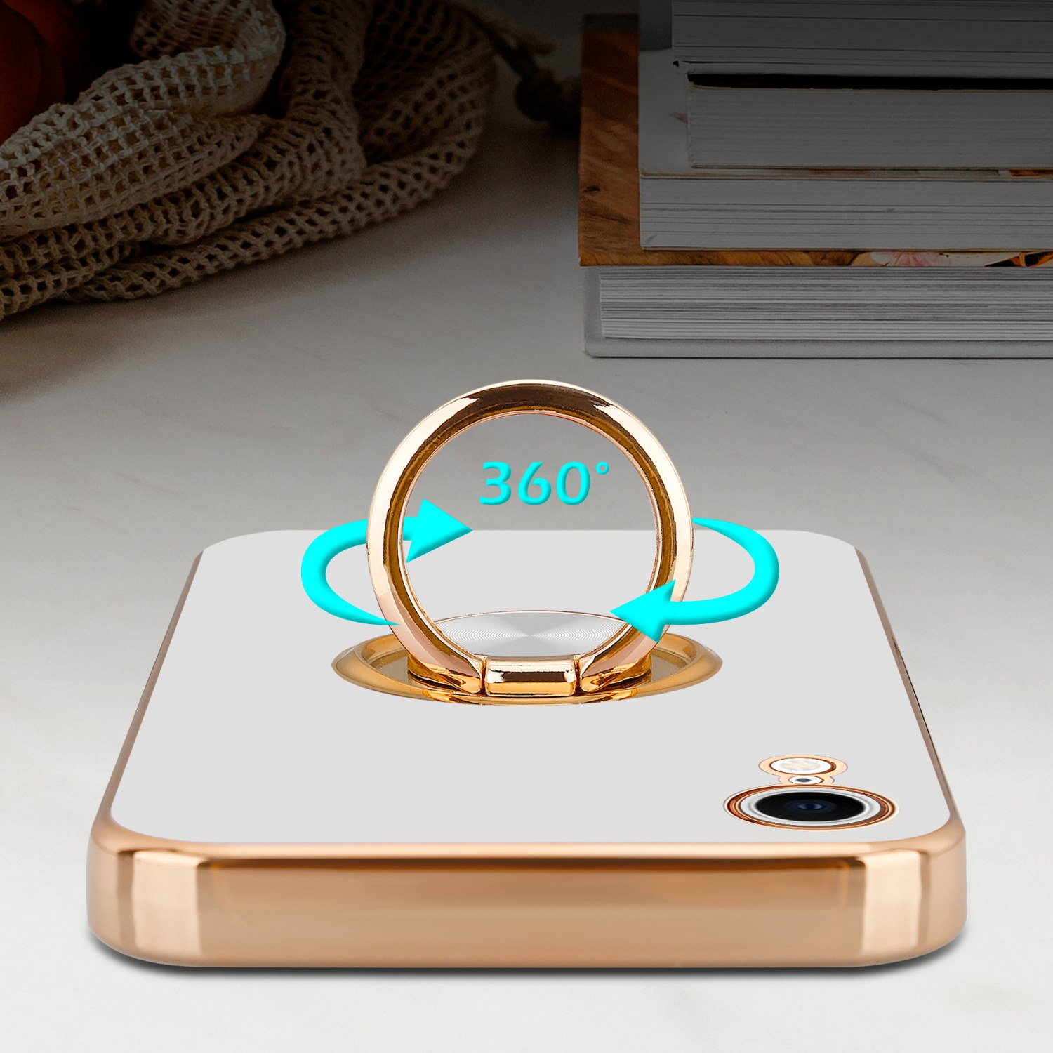 Weißes Telefon mit Ringhalter, goldene Ränder. 360°-Ring mit Pfeilen.