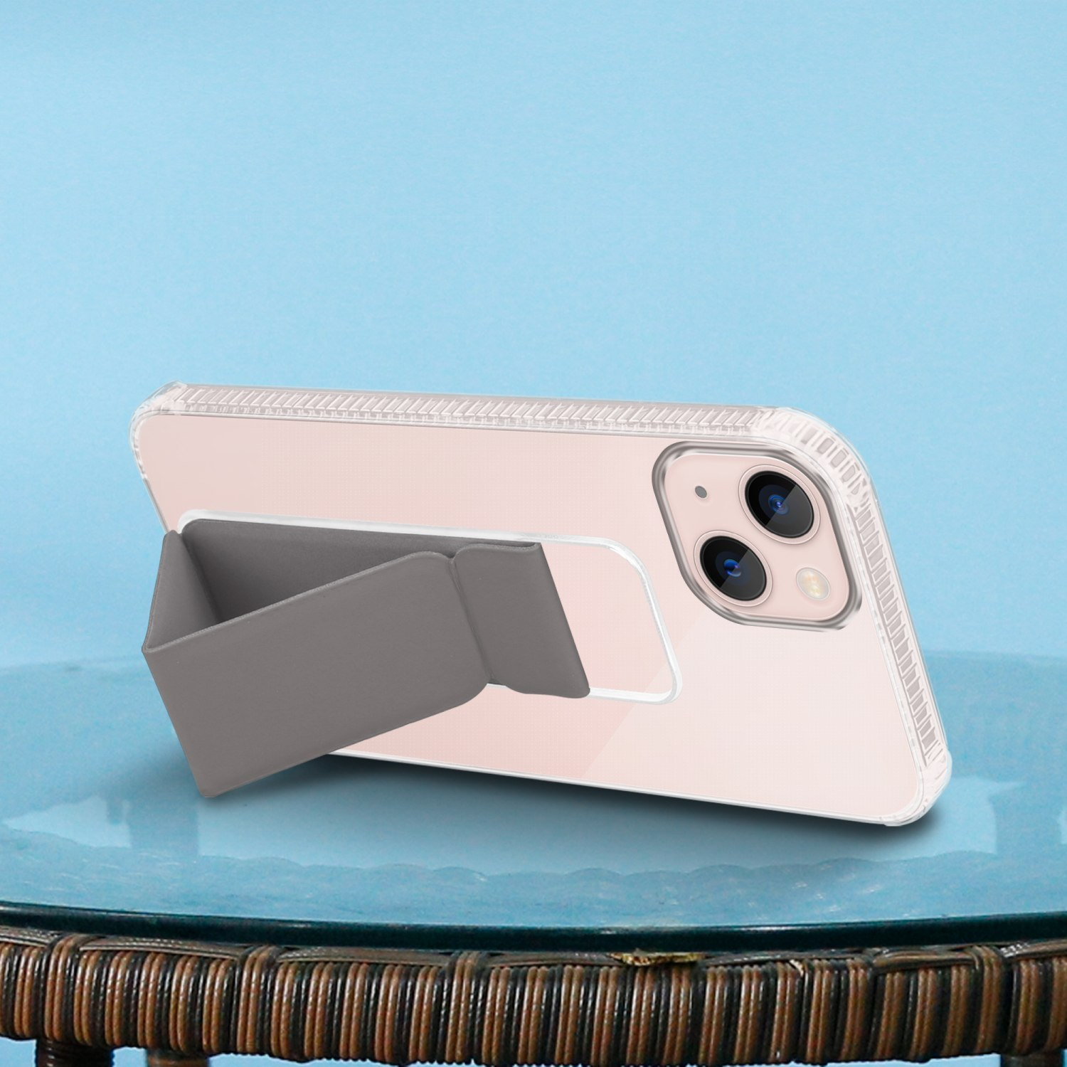 Telefon mit Ständer. Das Telefon ist in einer Hülle und abgewinkelt. Der Ständer ist grau.