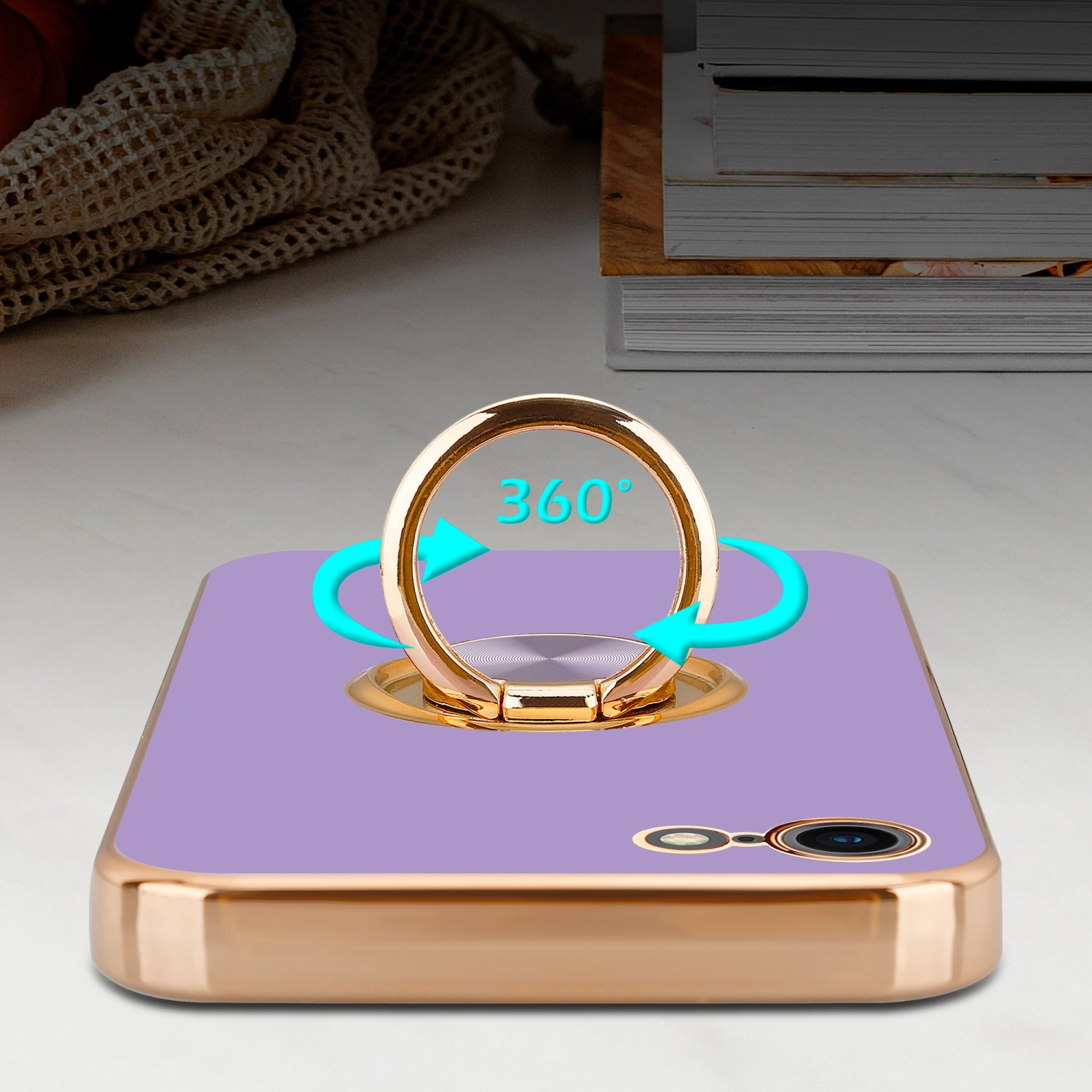 Eine Handyhülle mit Ring wird gezeigt, mit Pfeilen, die eine 360°-Drehung anzeigen. Die Hülle ist lila.