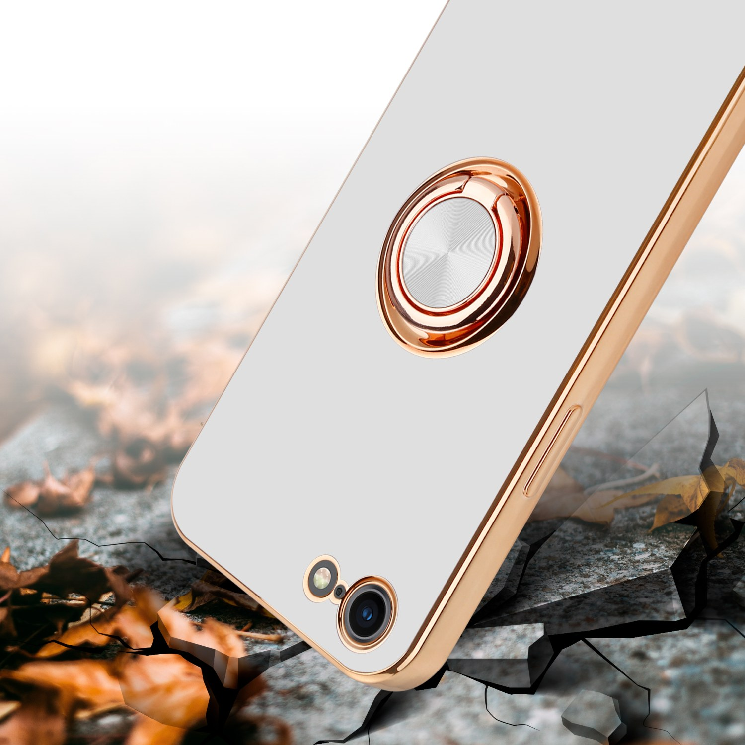 Goldene Handyhülle mit Ringhalter. Telefon auf zerbrochener Steinoberfläche.