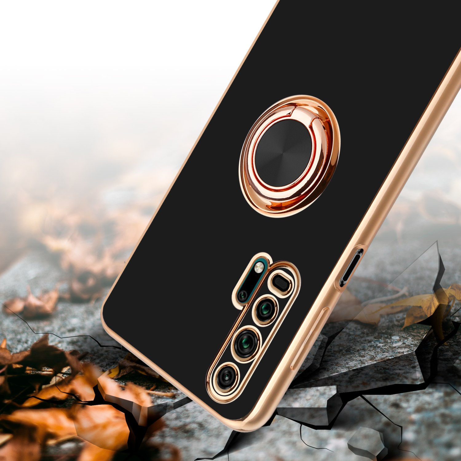 Schwarze Handyhülle mit goldenem Ring. Risse am Boden. Dunkler Hintergrund.