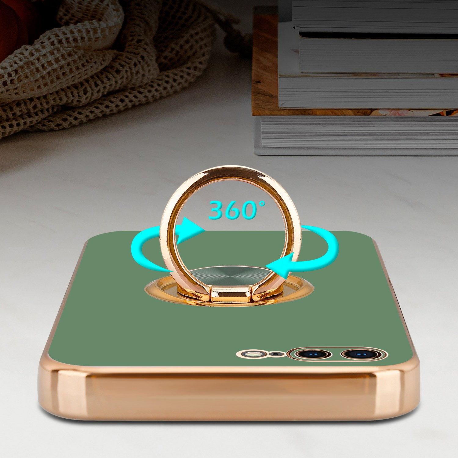Telefon mit grüner Hülle und Ringhalter. Grüner Bildschirm. Goldener Rahmen und Ring. Blaue Pfeile.