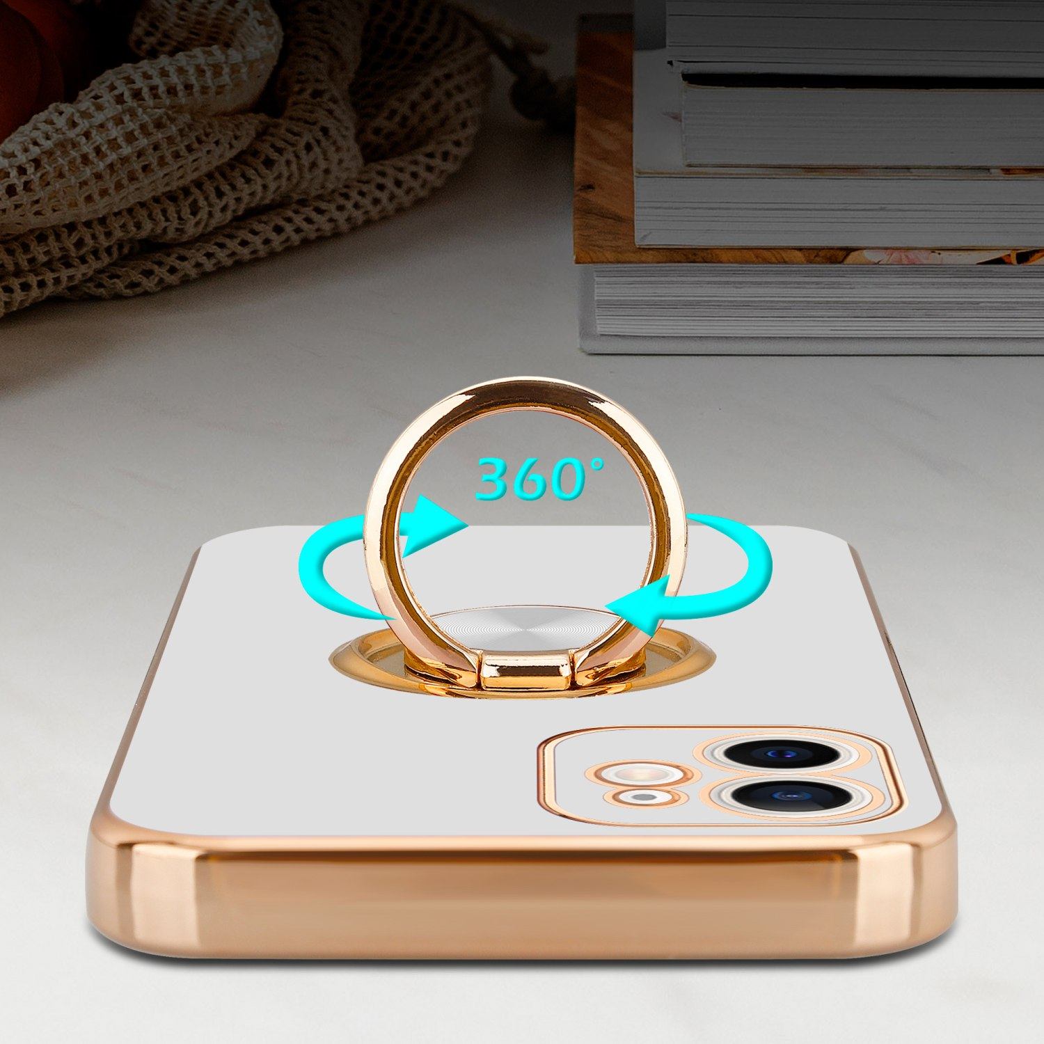 Eine goldene Handyhülle mit einem Ringhalter und eine Nahaufnahme auf weißem Hintergrund.