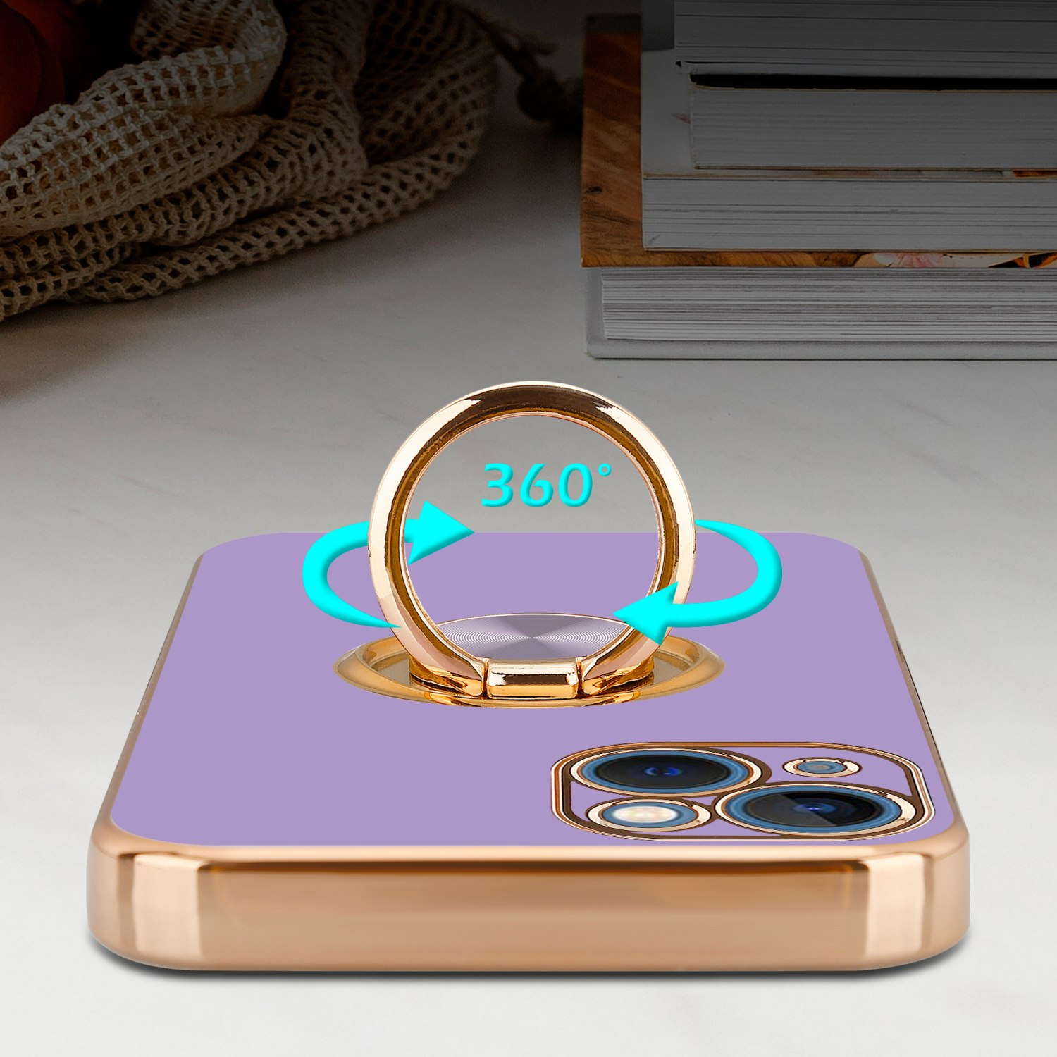 Eine Handyhülle mit Ringhalter. Die Hülle ist lila und gold. Der Ring kann sich um 360 Grad drehen.