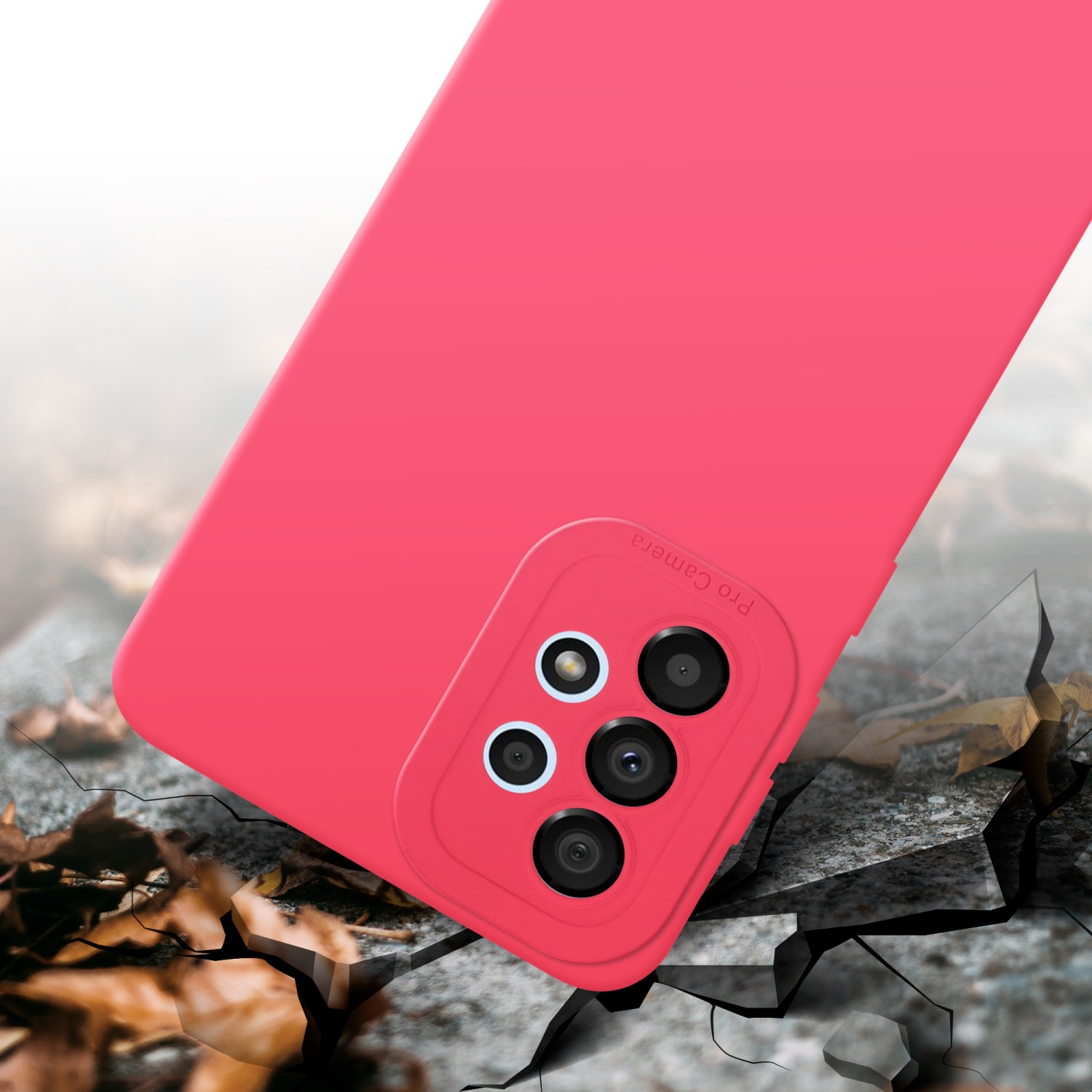 Custodia rosa per telefono con protuberanza della fotocamera. La custodia sembra rompere una superficie.