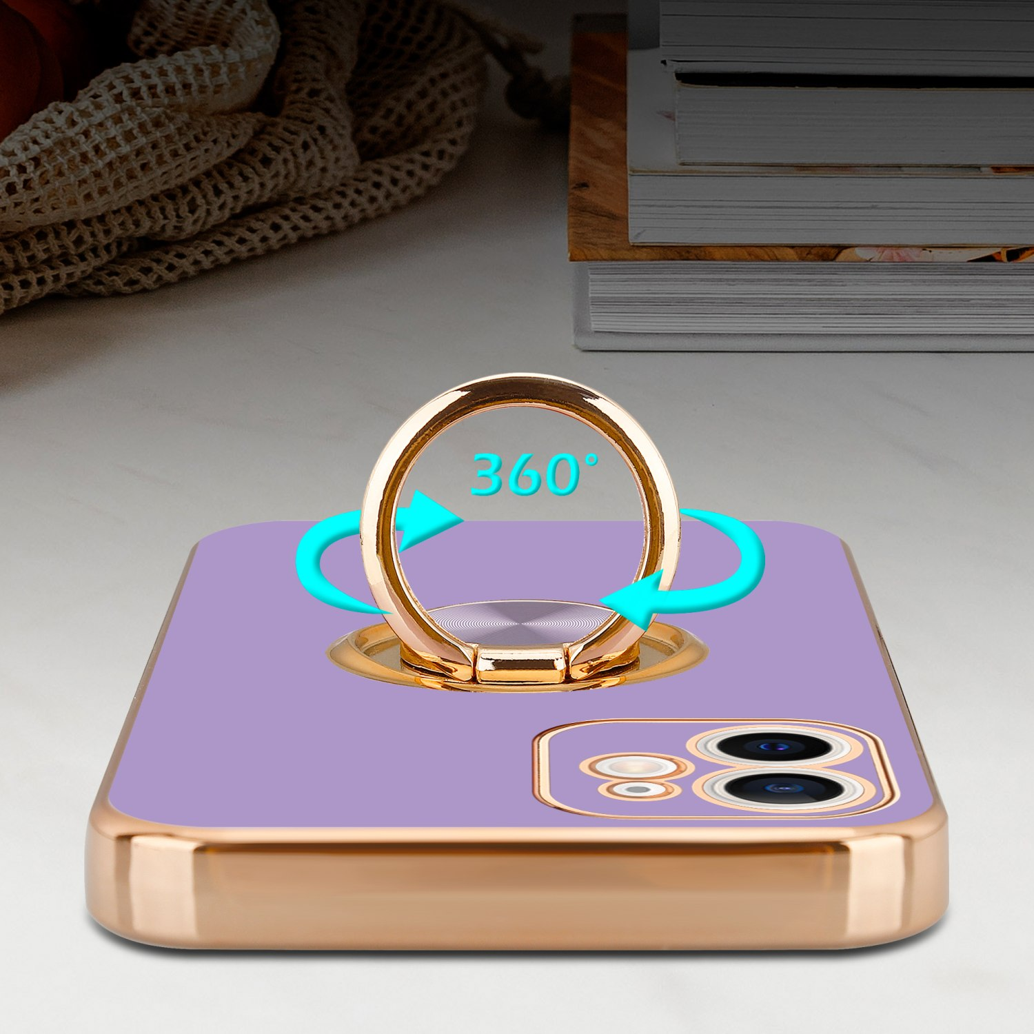 Eine lila Handyhülle mit einem goldenen Ringhalter, mit Pfeilen, die eine 360-Grad-Drehung anzeigen.