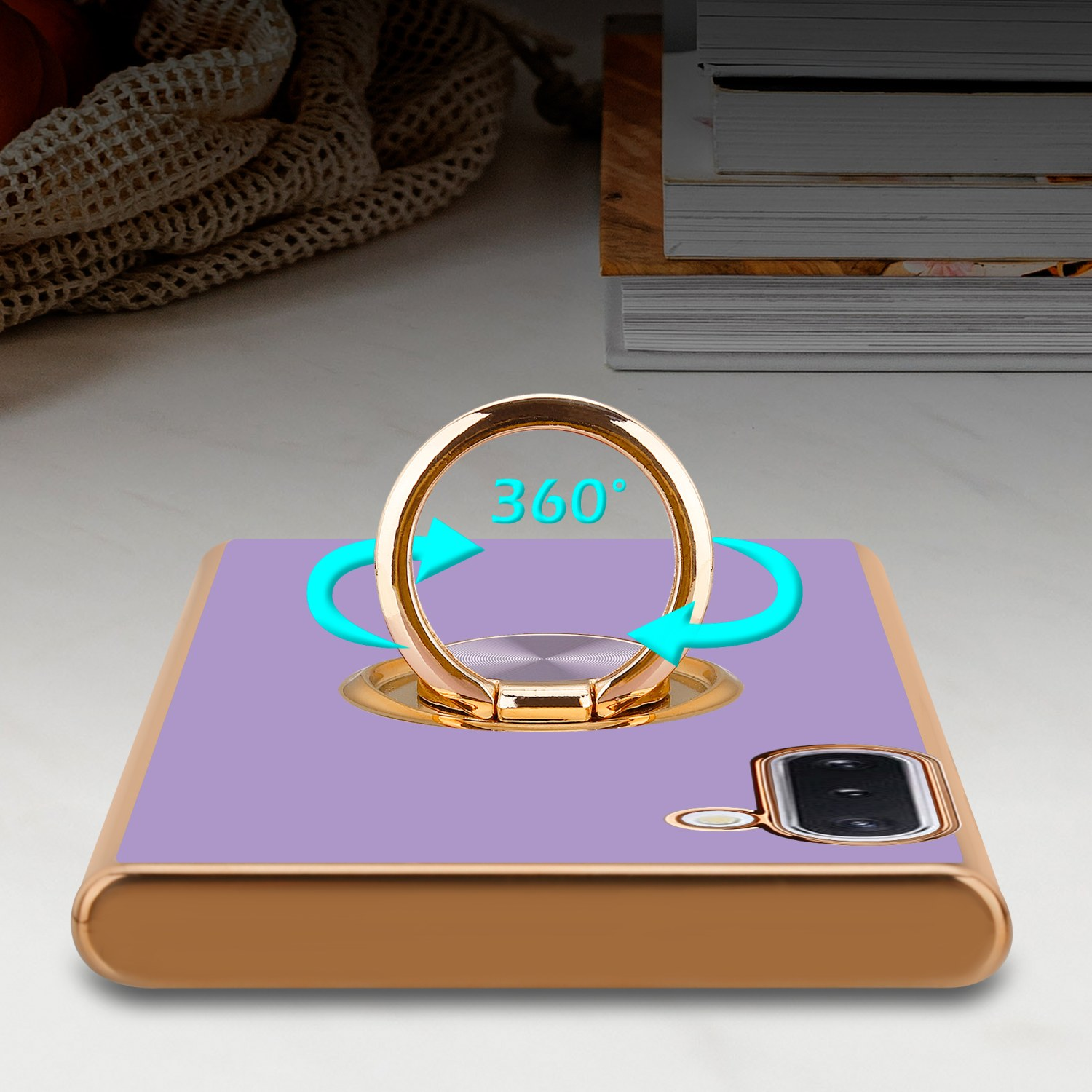 Custodia per telefono viola con supporto ad anello dorato. Le frecce mostrano la rotazione a 360 gradi.