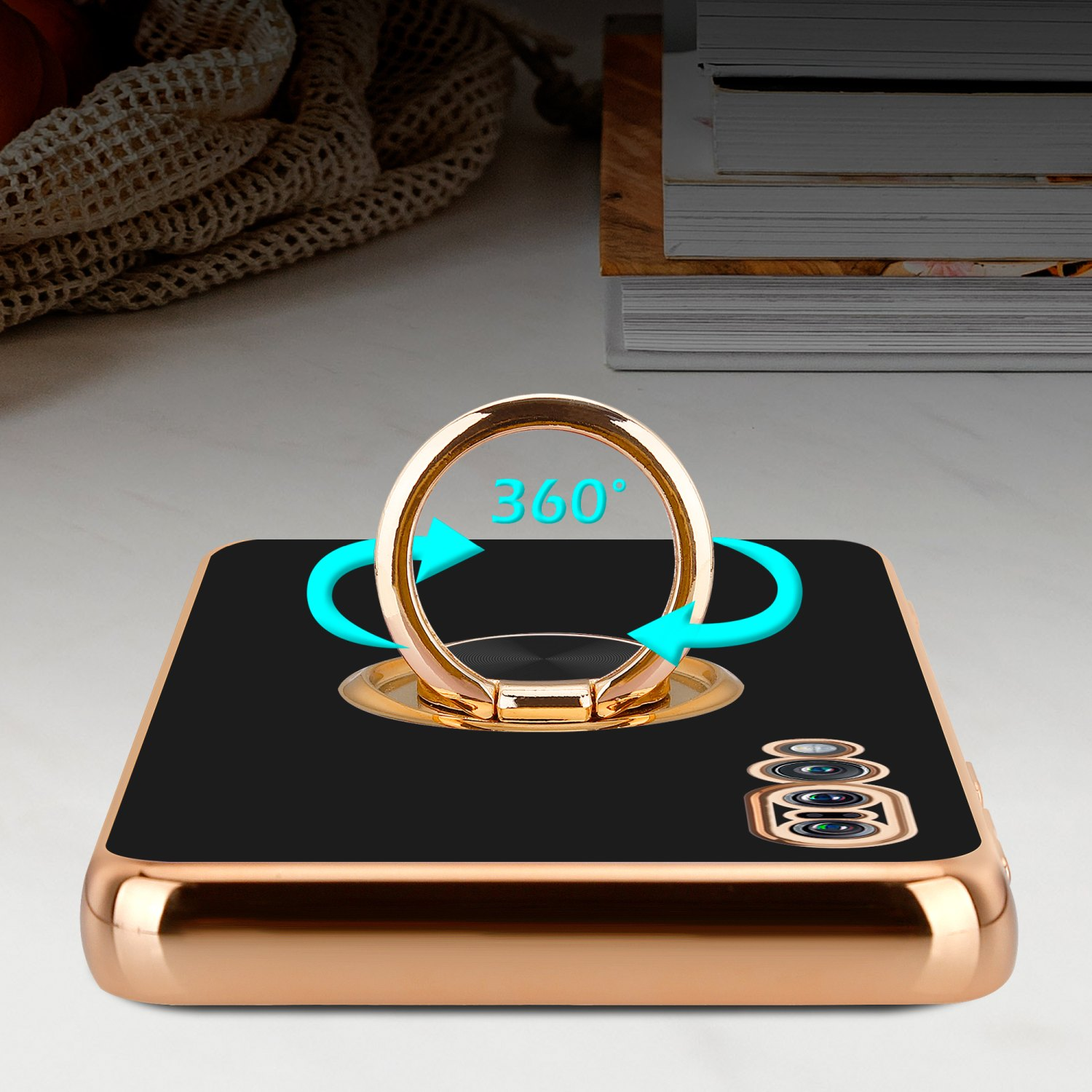 Eine Handyhülle mit Ring wird gezeigt, mit Pfeilen, die eine 360°-Drehung anzeigen. Die Hülle ist schwarz.