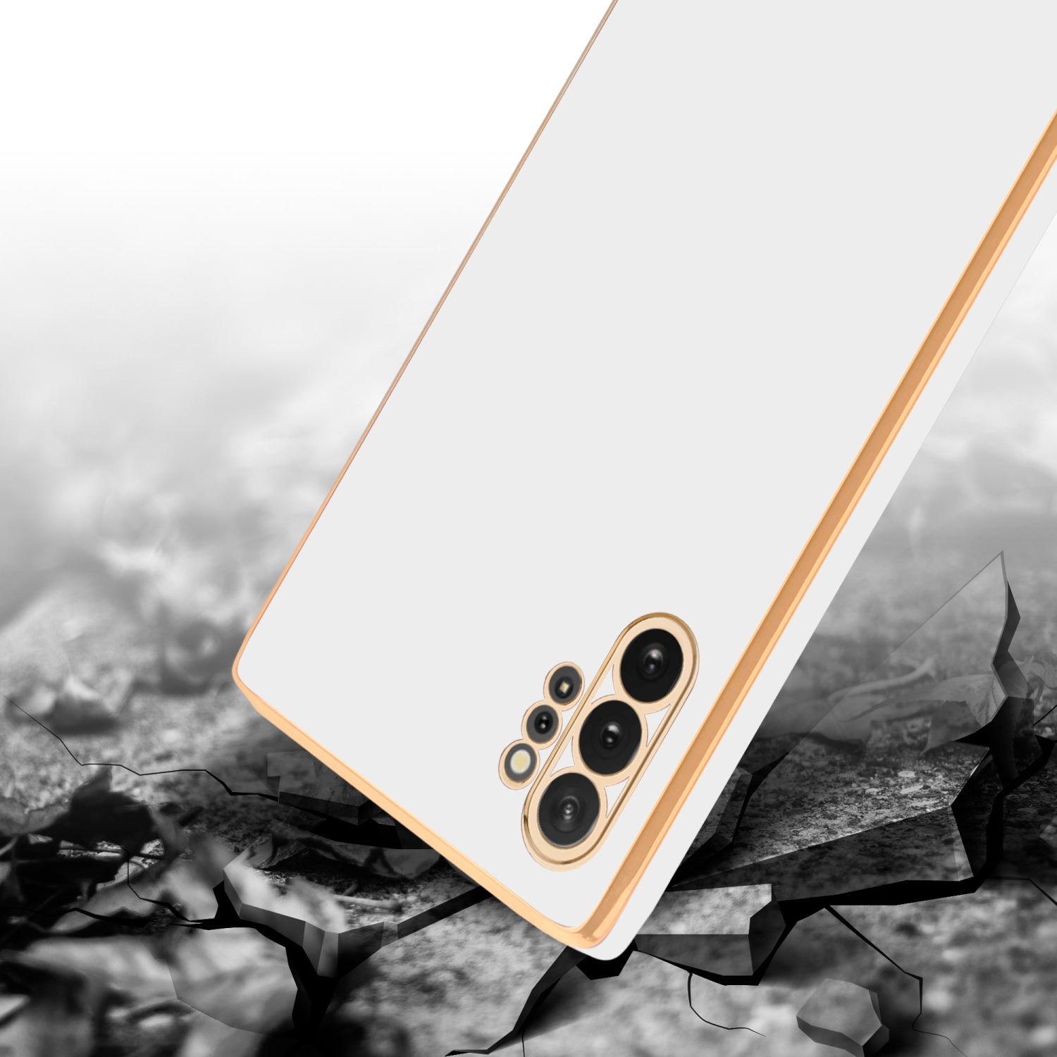 Ein weißes Telefon mit Goldrahmen fällt auf eine zerbrochene Oberfläche mit dunklem Hintergrund.
