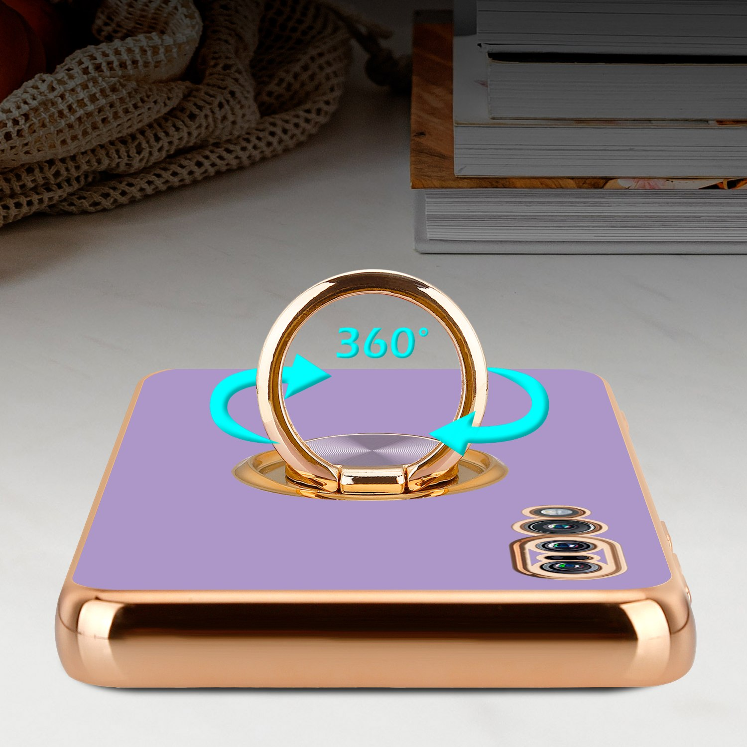 Handyhülle mit goldenem Ring, lila Rückseite und Pfeilen, die eine 360-Grad-Drehung anzeigen.