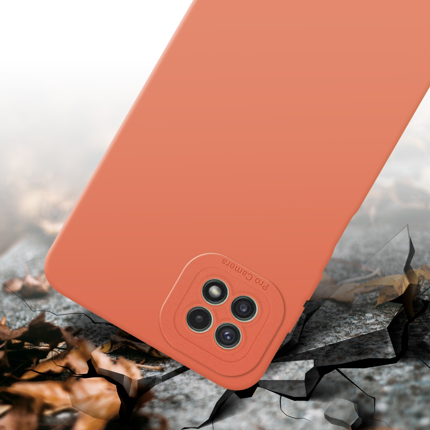 Coque de téléphone orange, sol fissuré. Coque avec détails de caméra.
