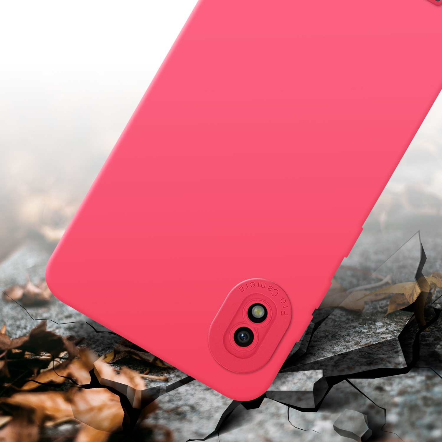 Custodia rosa per telefono su superficie crepata, simile a pietra. Sfondo sfocato.