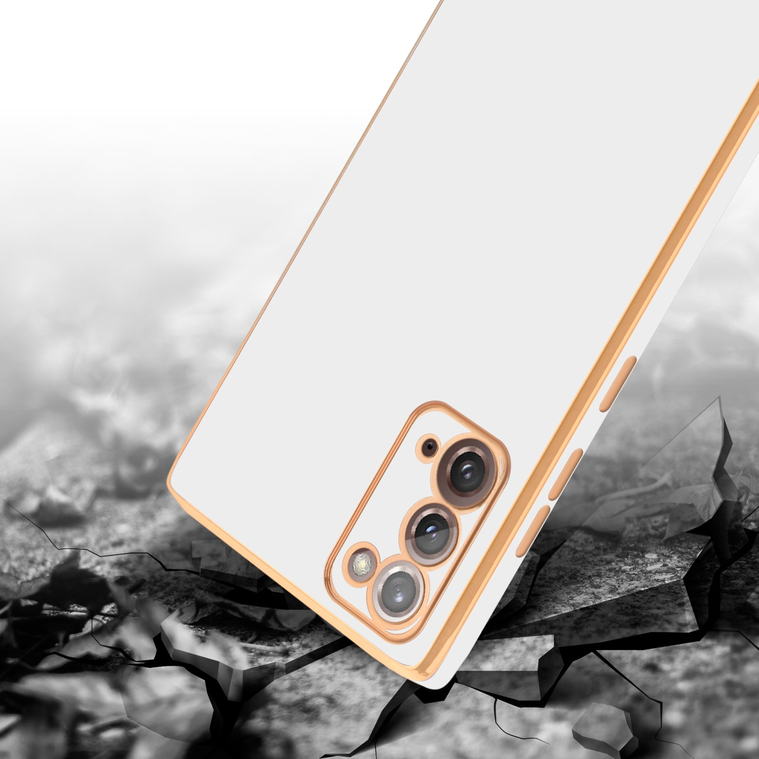 Weißes Telefon mit goldenem Rahmen fällt auf einen rissigen, grauen Boden.