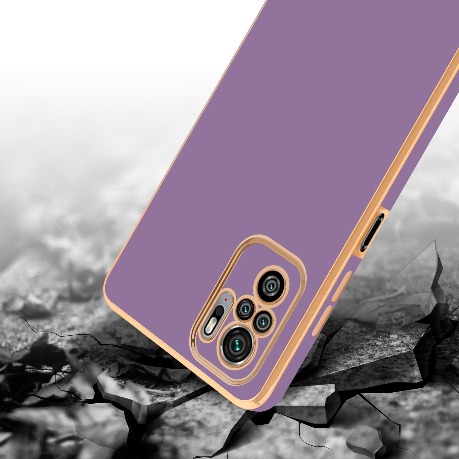 Custodia viola per telefono che cade su un terreno crepato con cornice dorata.