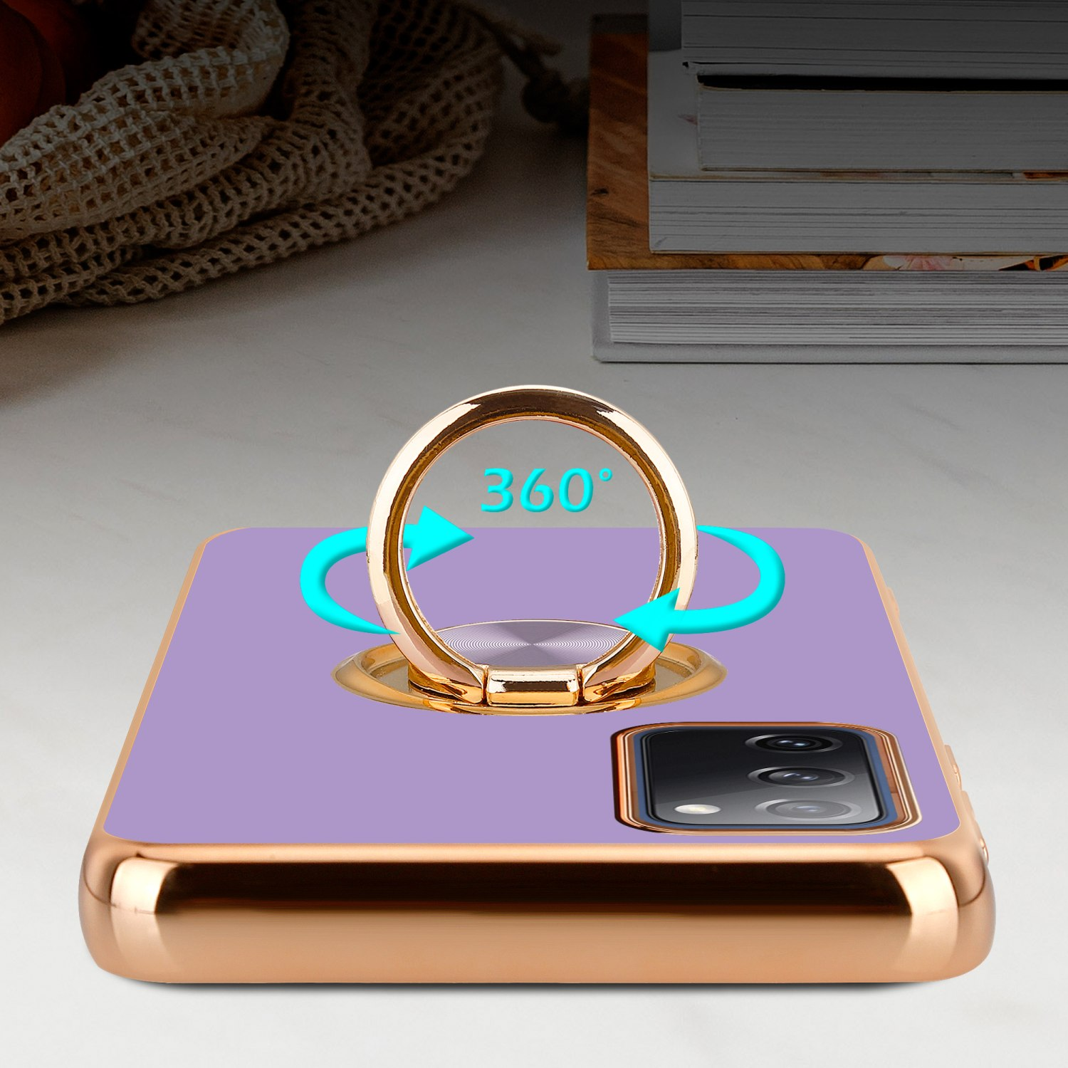 Handyhülle mit goldenem Ring, lila Rückseite und goldener Umrandung. Pfeile zeigen 360° Drehung.
