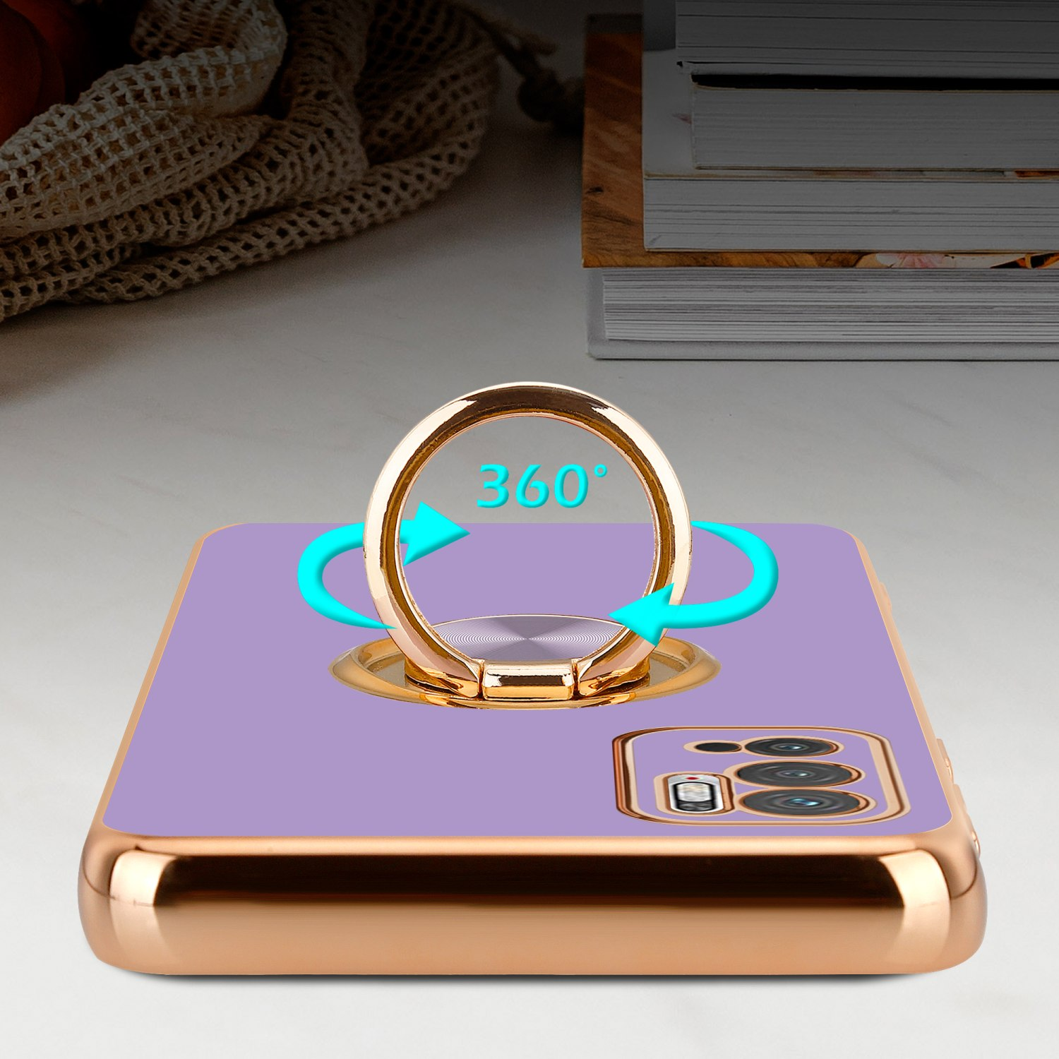 Eine lila Handyhülle mit einem goldenen Ringhalter. Pfeile zeigen 360-Grad-Drehung an.