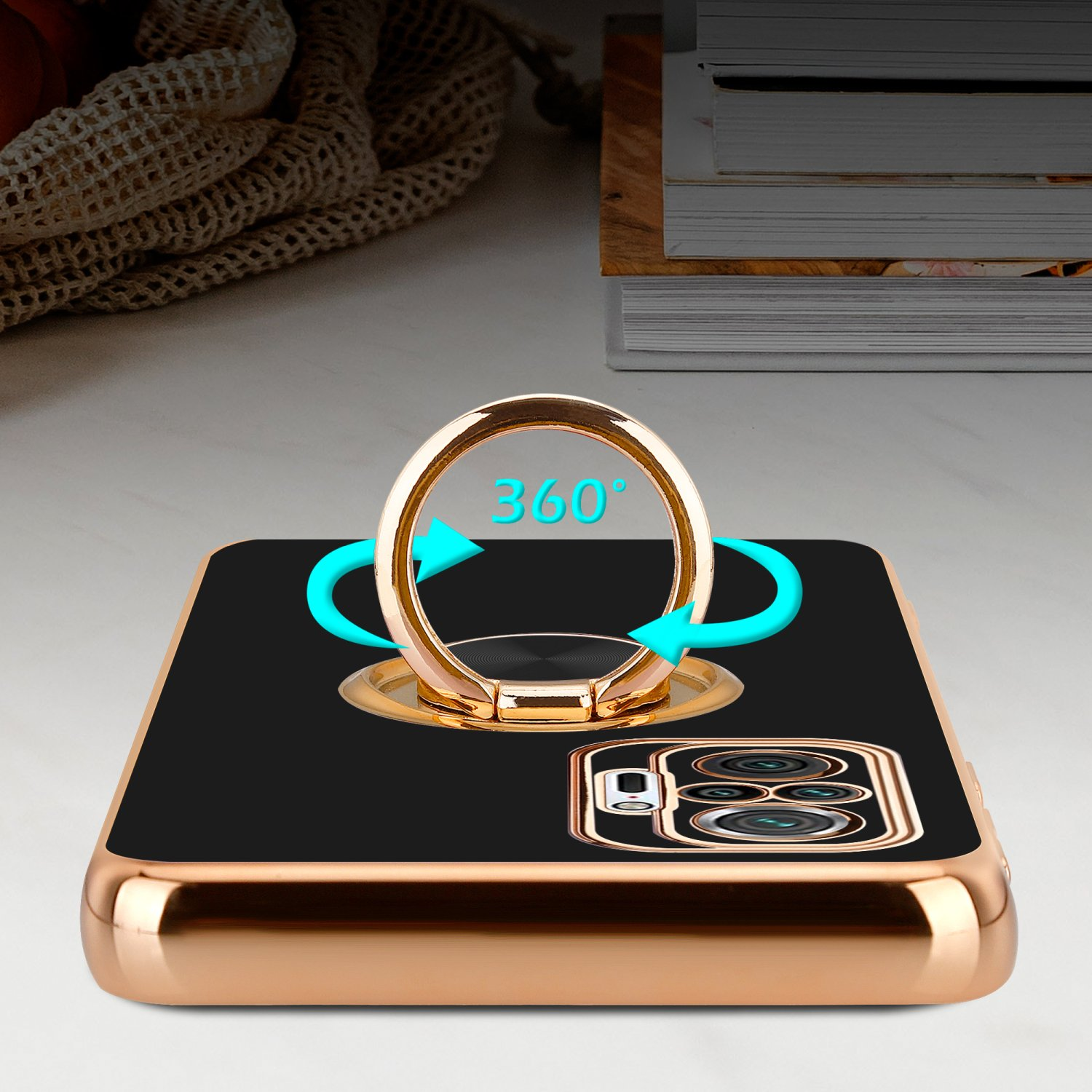 Schwarze Handyhülle mit goldenem Ringhalter. Der Ring ist um 360 Grad drehbar.